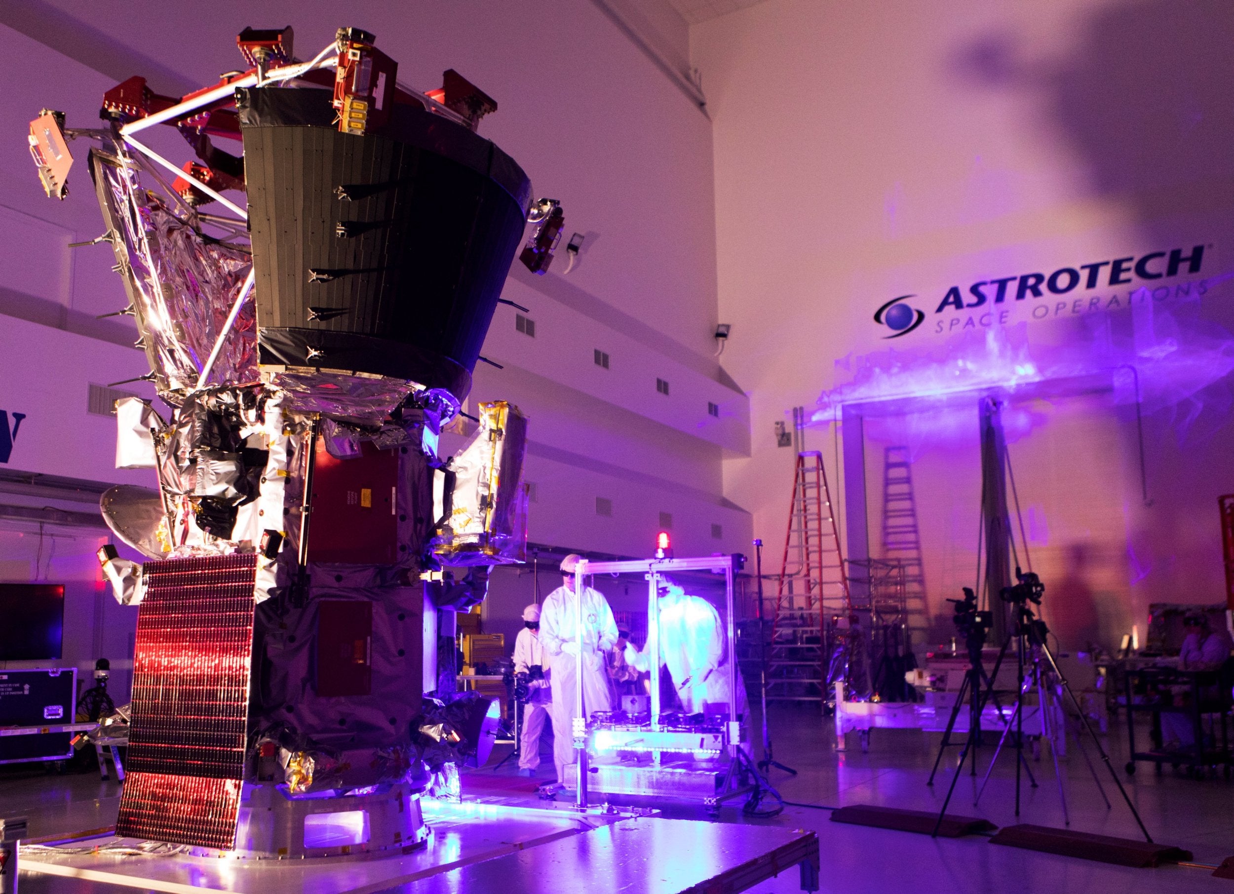 Technicians and engineers perform light bar testing on Nasa’s Parker Solar Probe, which will travel through the Sun’s atmosphere, in the Astrotech processing facility near the Kennedy Space Center in Titusville, Florida