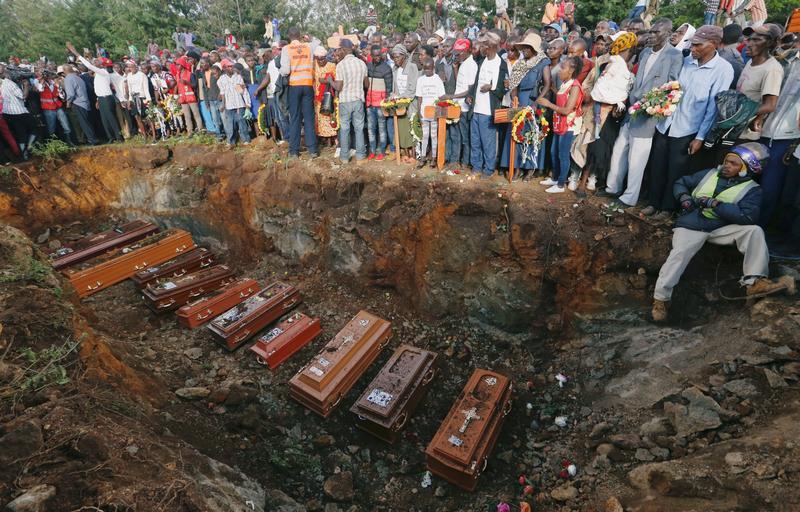 Mass burial of people killed when a dam burst its walls in Kenya