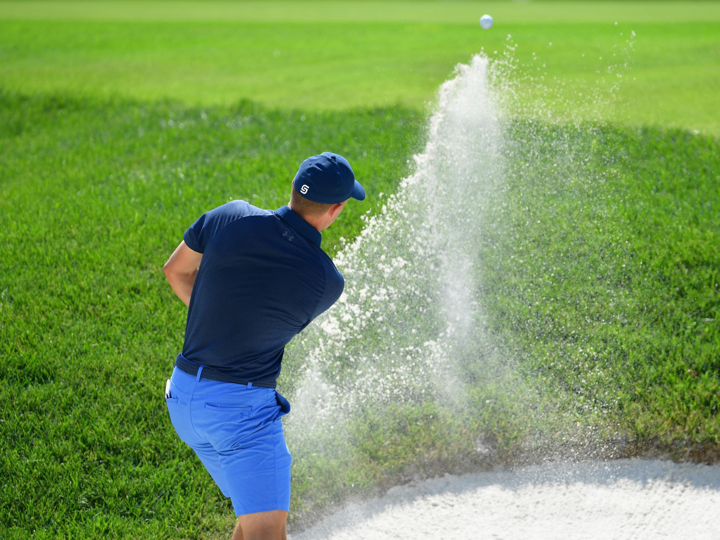 Jordan Speith perfects his bunker shot at the Bellerive Country Club