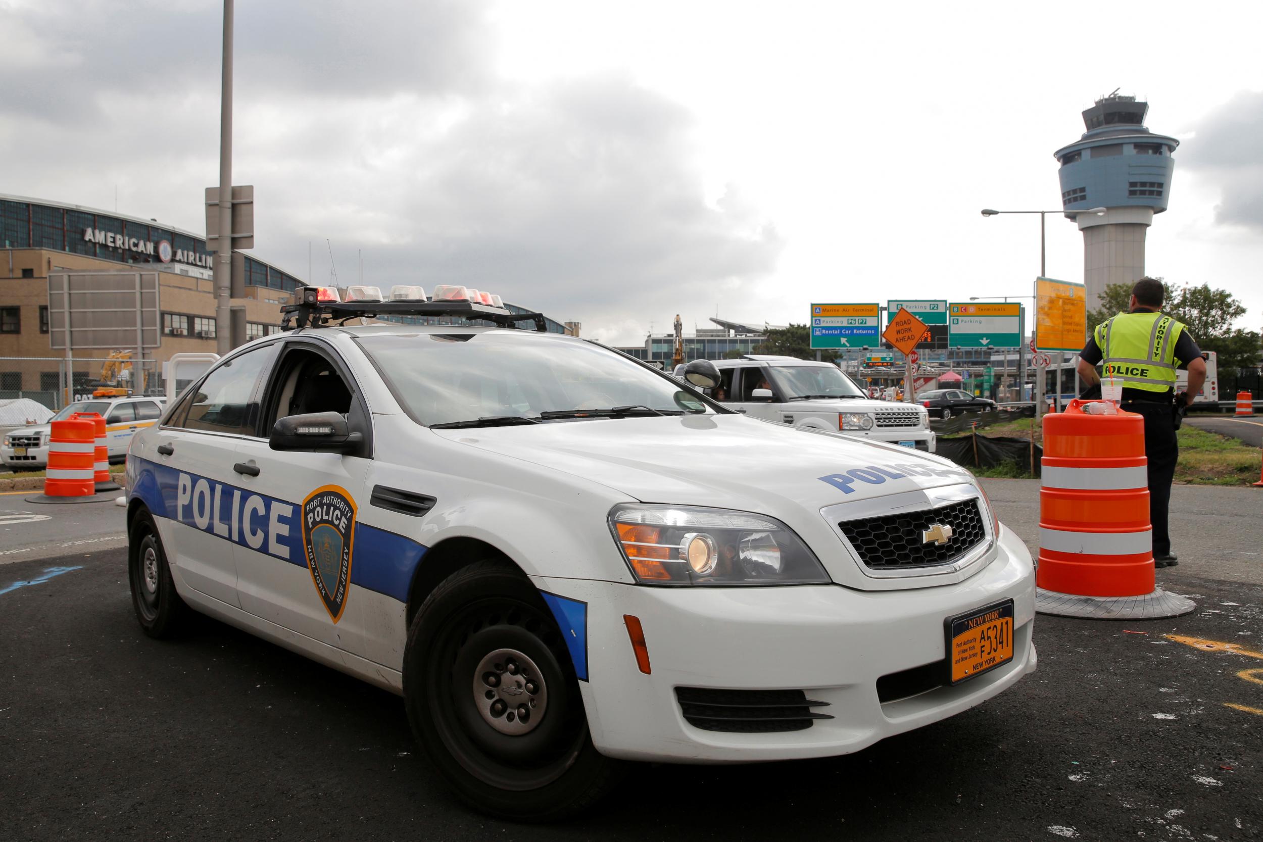 Police monitoring the entrance to New York's La Guardia airport.