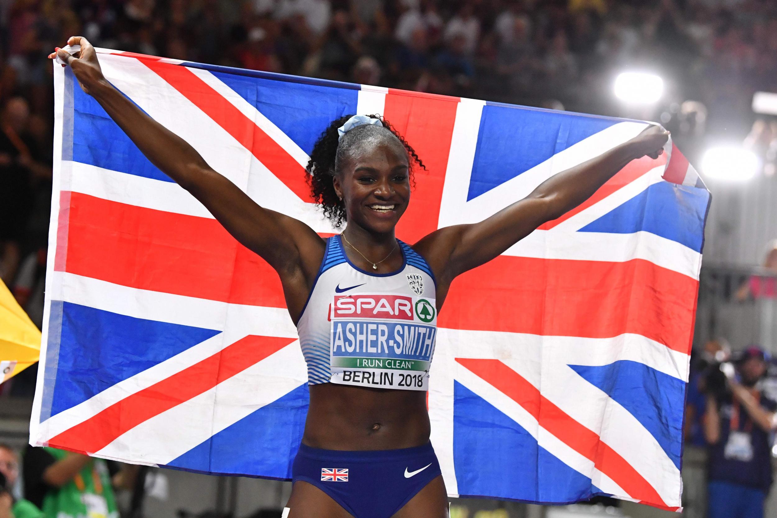 Dina Asher-Smith celebrates her 100m final win