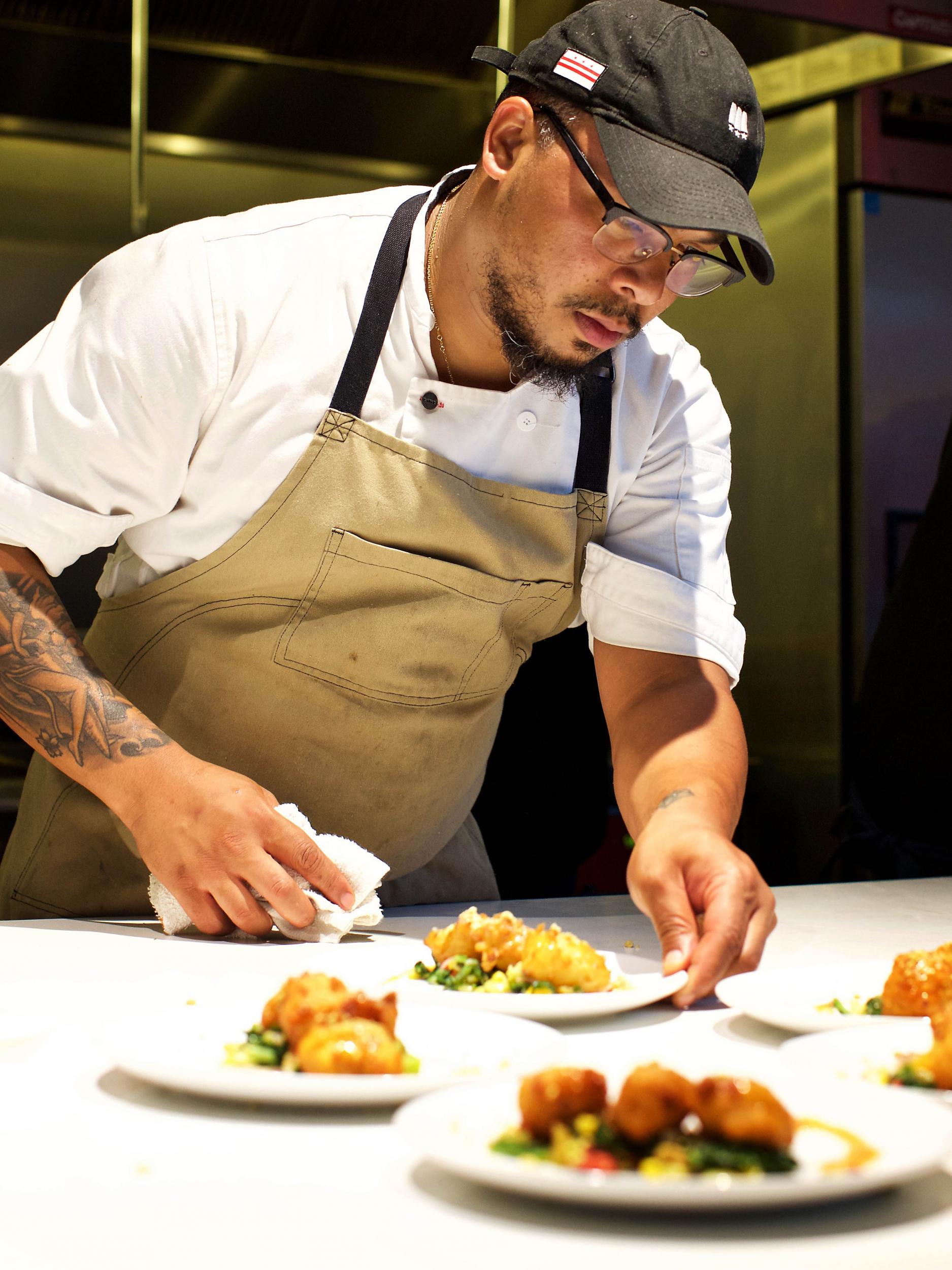 Jerome Grant plates a dish at the Soul Food Sessions dinner