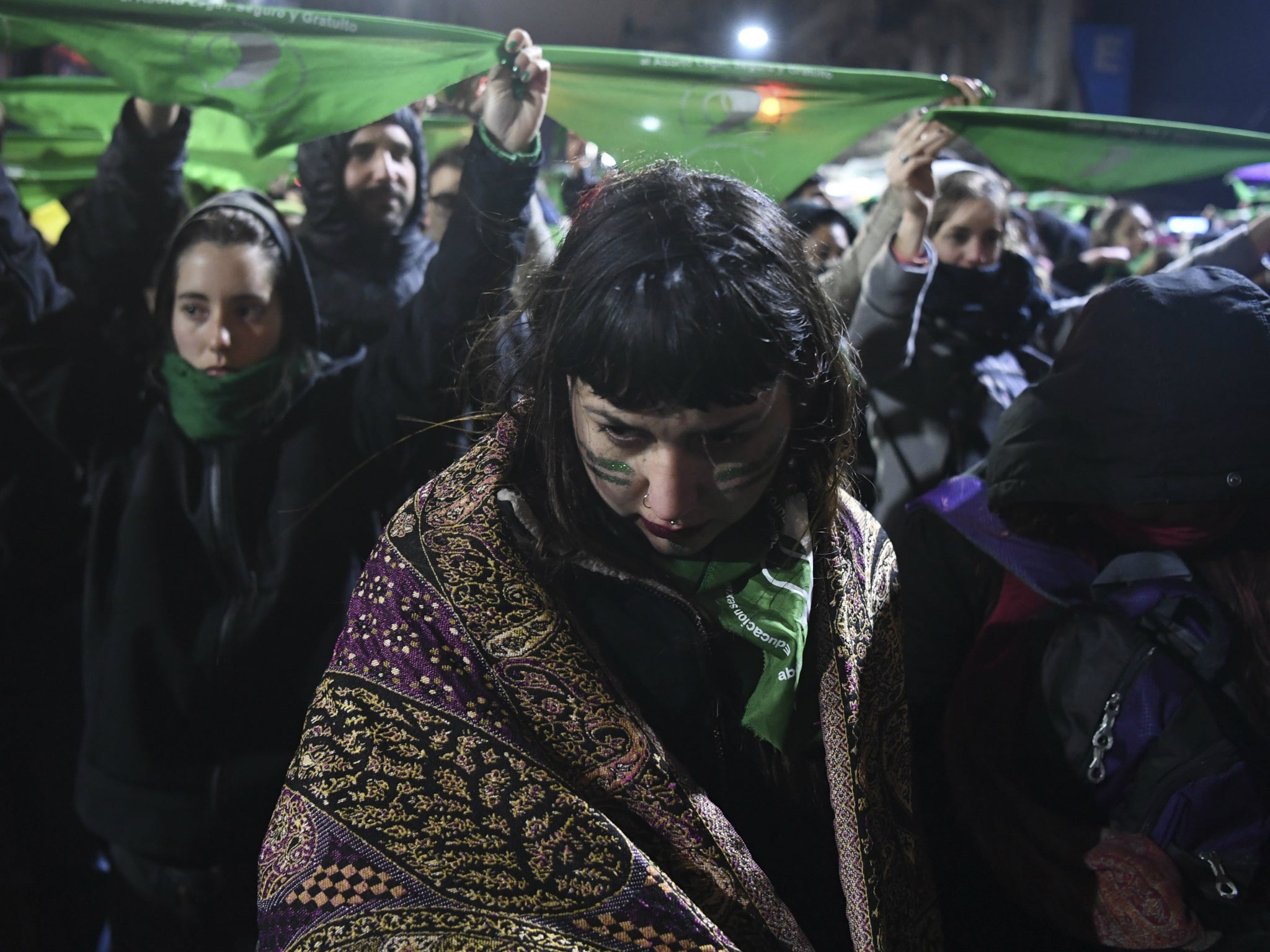 Activists in favour of the legalisation react outside the National Congress