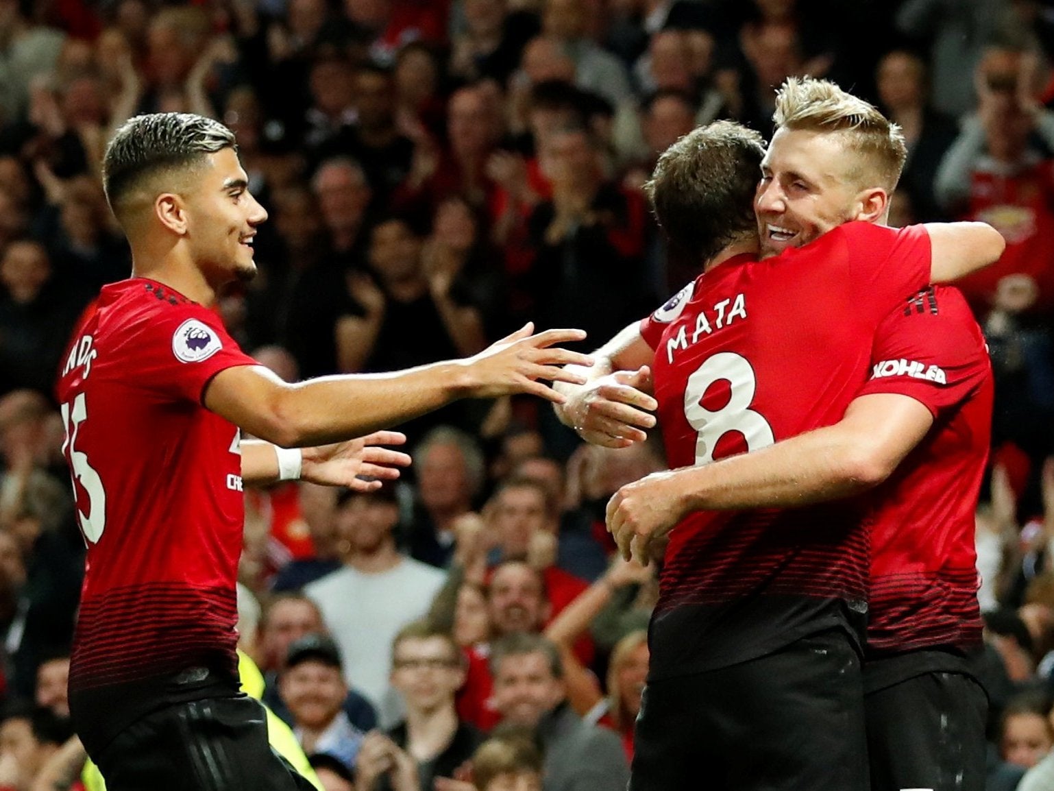 Luke Shaw celebrates his goal with Juan Mata