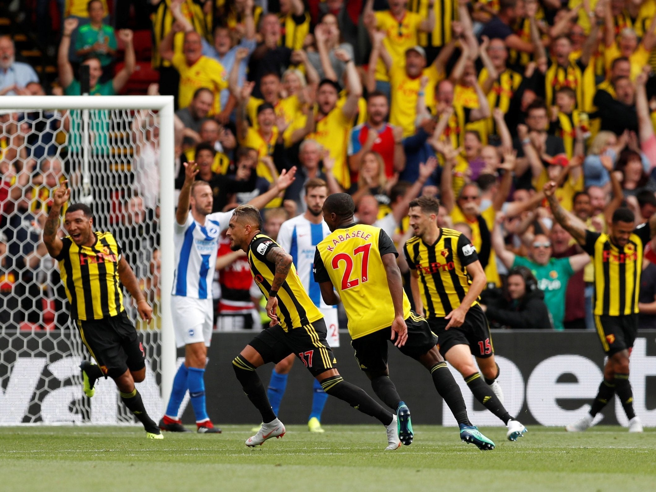 Roberto Pereyra peels away to celebrate his first goal