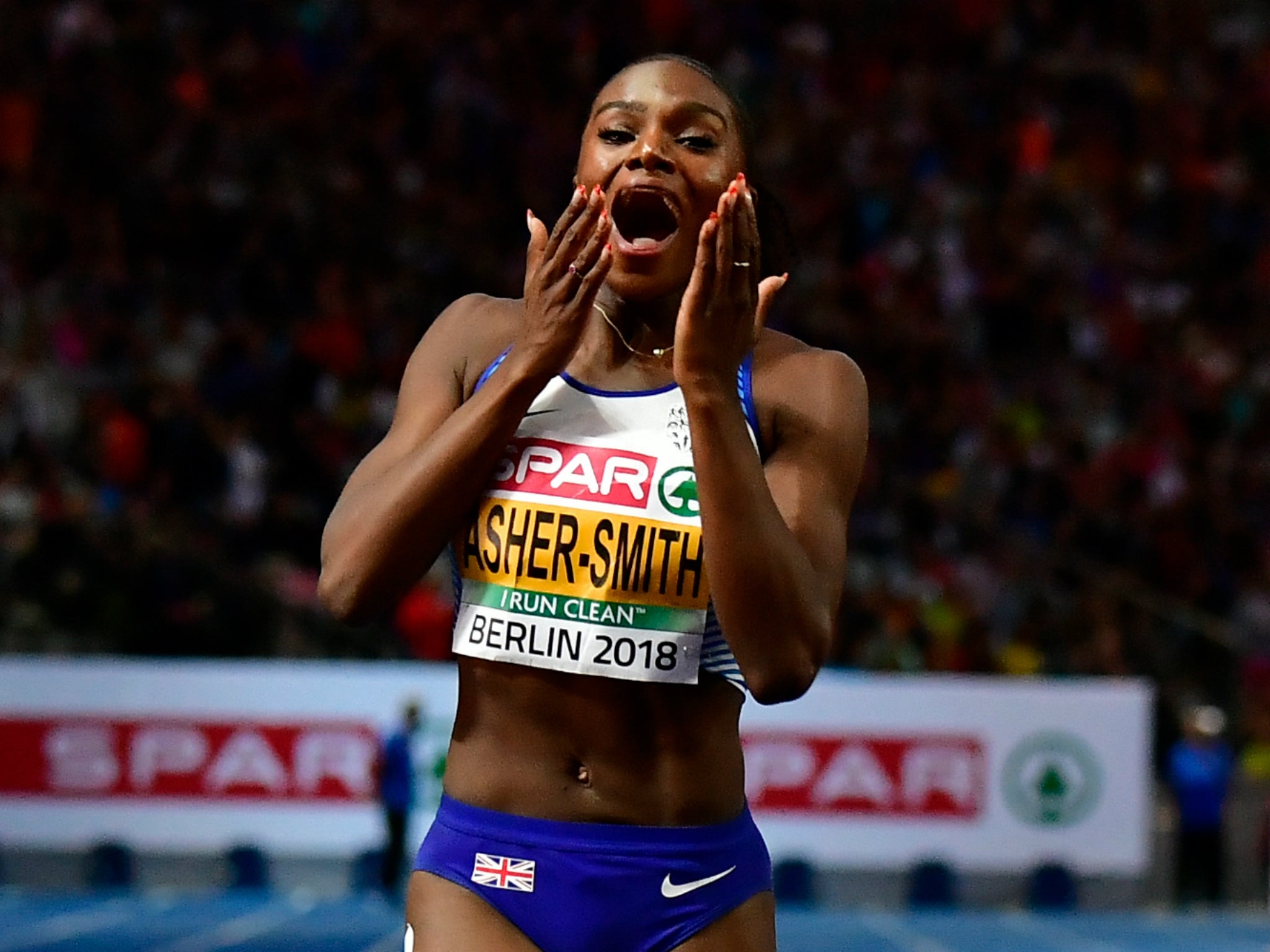 Dina Asher-Smith celebrates winning 200m gold at the European Championships