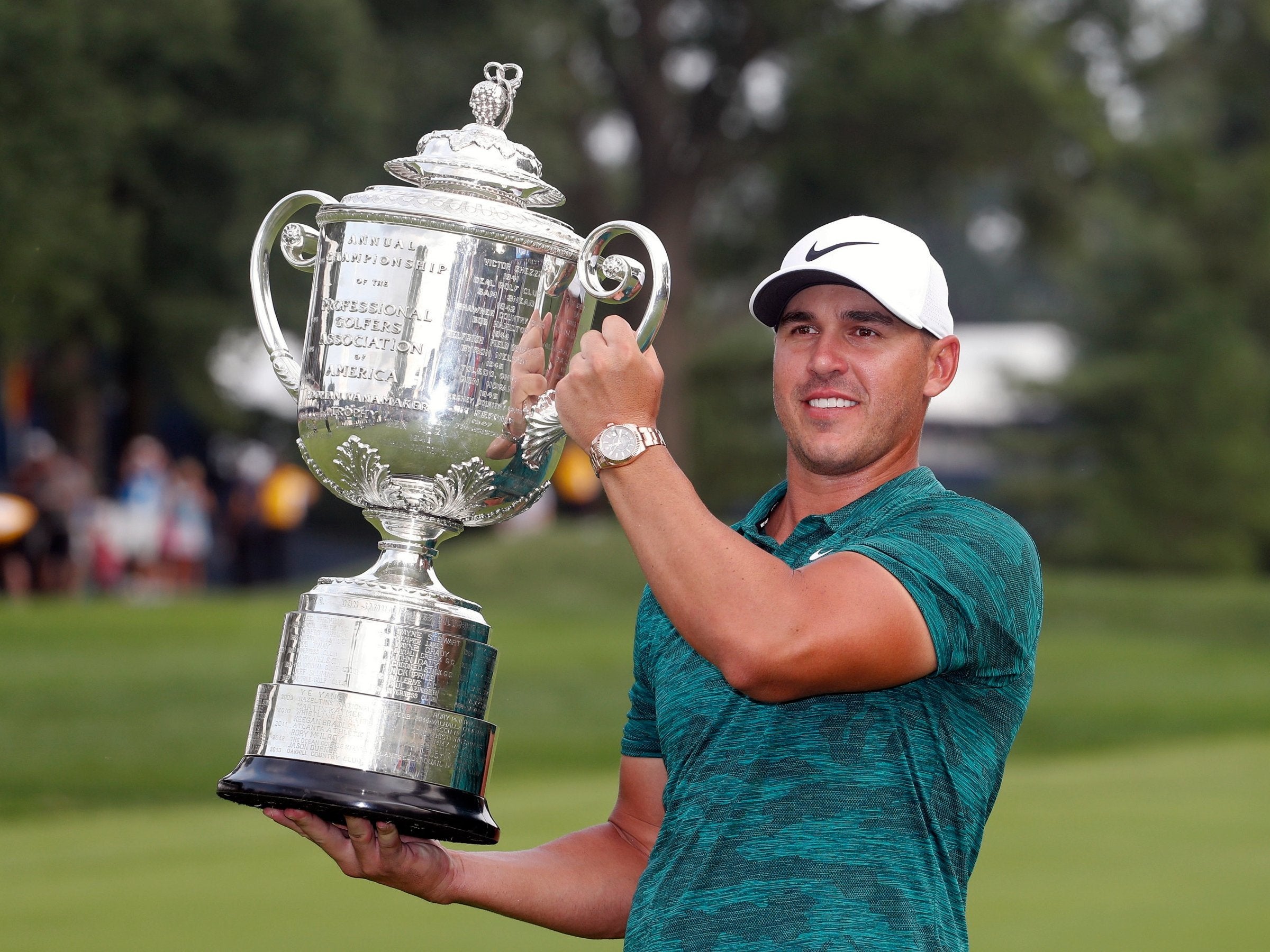 Brooks Koepka celebrates with the Wanamaker Trophy after winning the PGA Championship