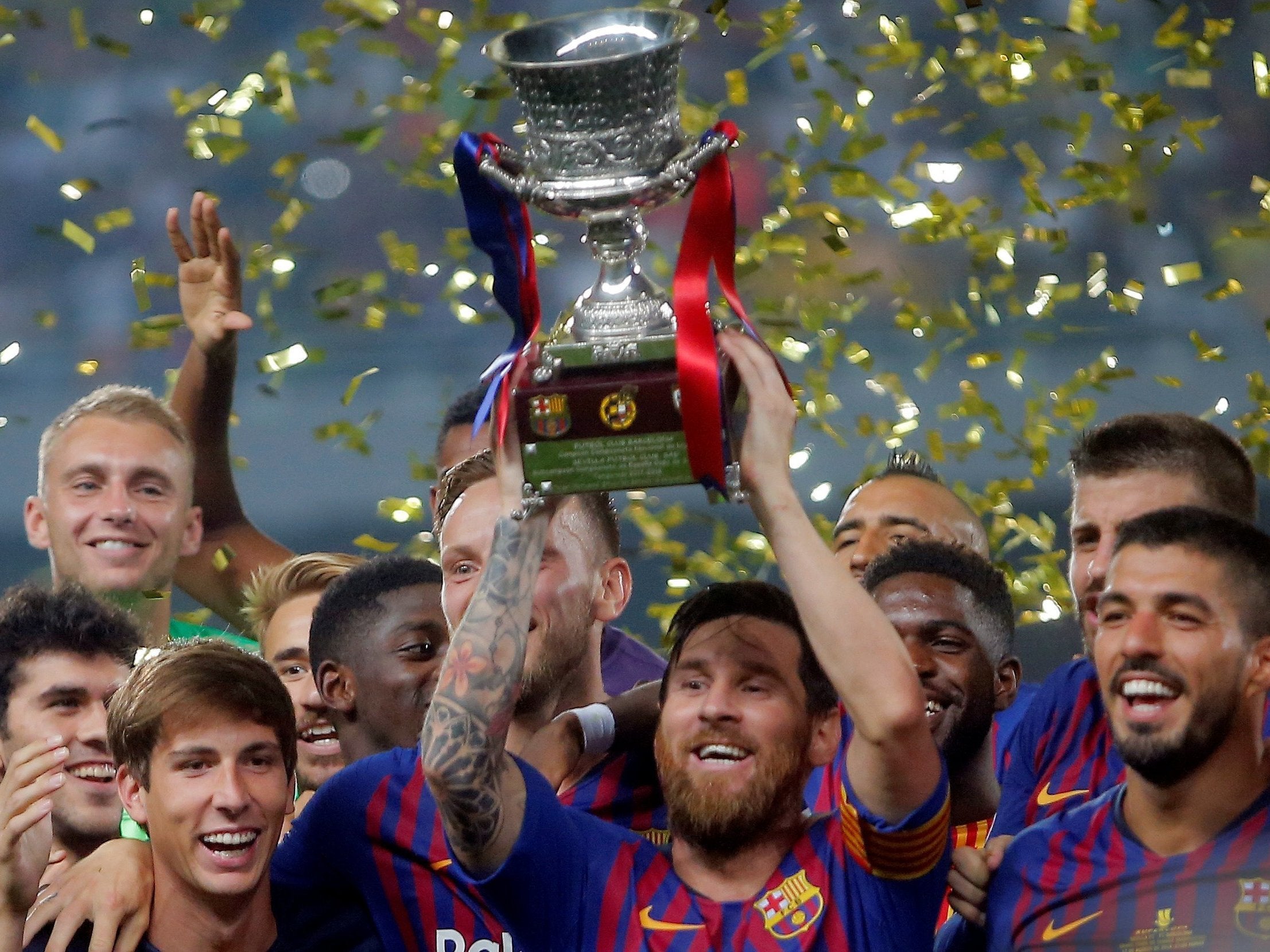 Lionel Messi lifts the Spanish Super Cup after Barcelona's victory over Sevilla