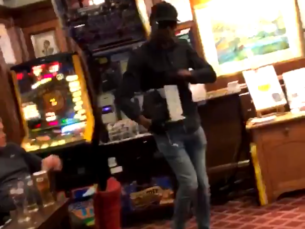 Man appears to steal money from a fruit machine at a pub in London