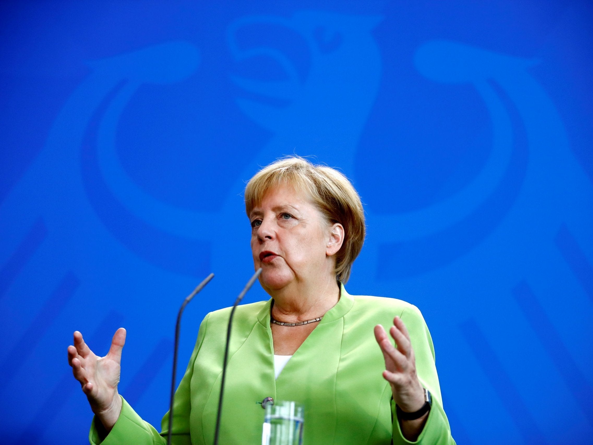 Merkel speaking at a news conference in Berlin, August 13