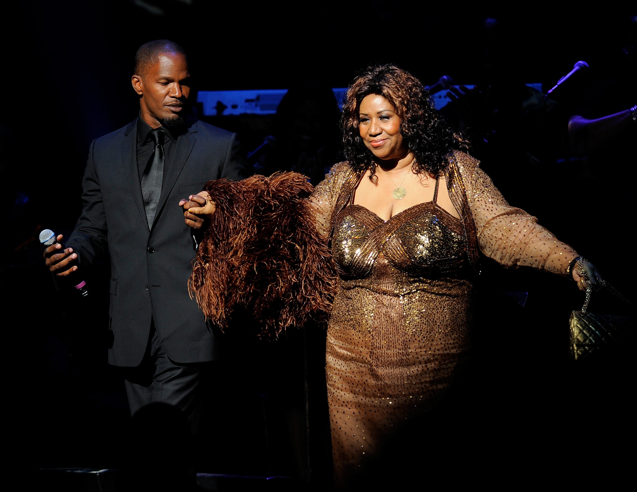 With comedian Jamie Foxx at the Apollo theatre in New York in 2010