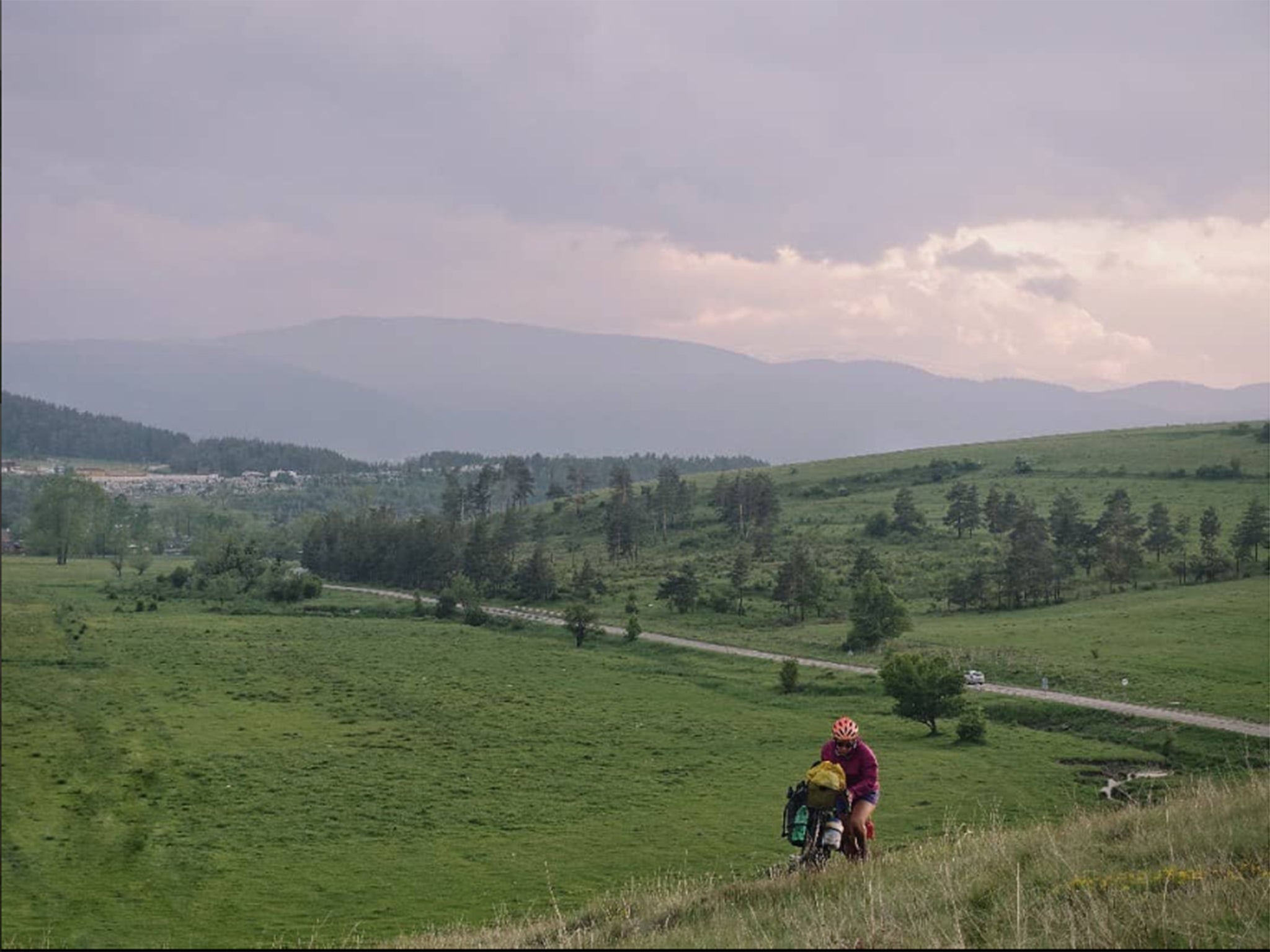 Finding a decent camp spot in Bulgaria ‘entails pushing two fairly heavy bicycles up a few fairly steep, fairly muddy hills for five or ten or fifteen minutes away from the road’