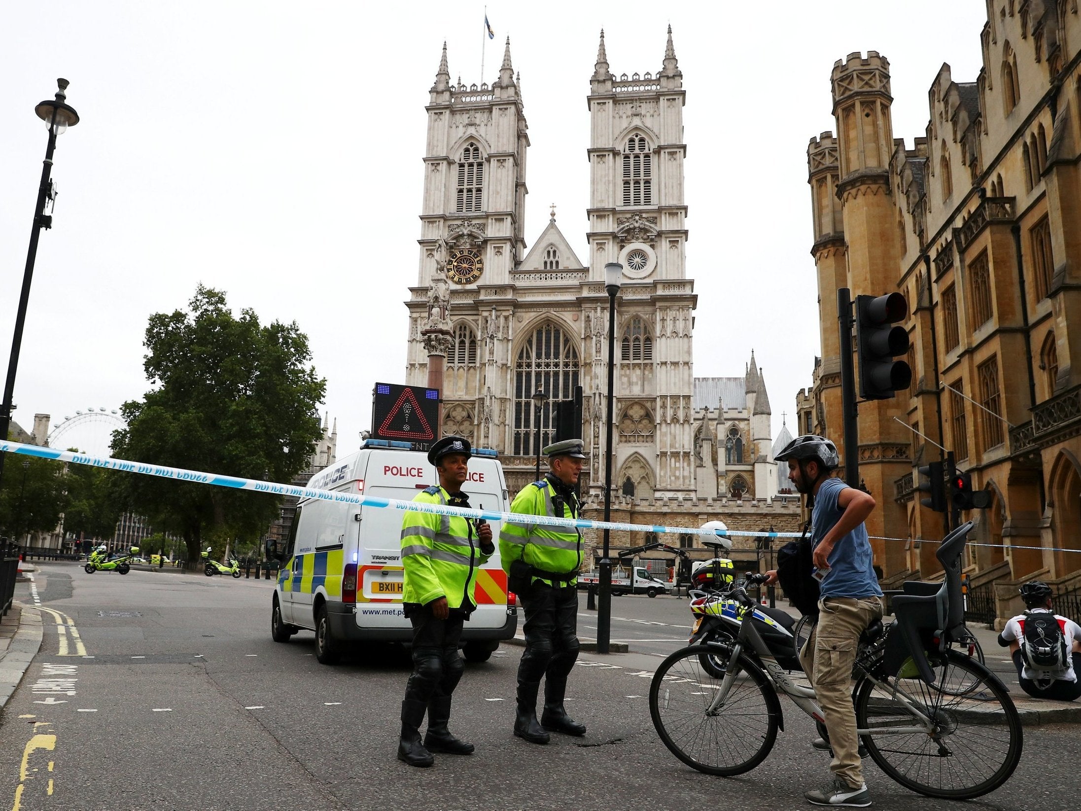 Police officers at a cordon after the crash