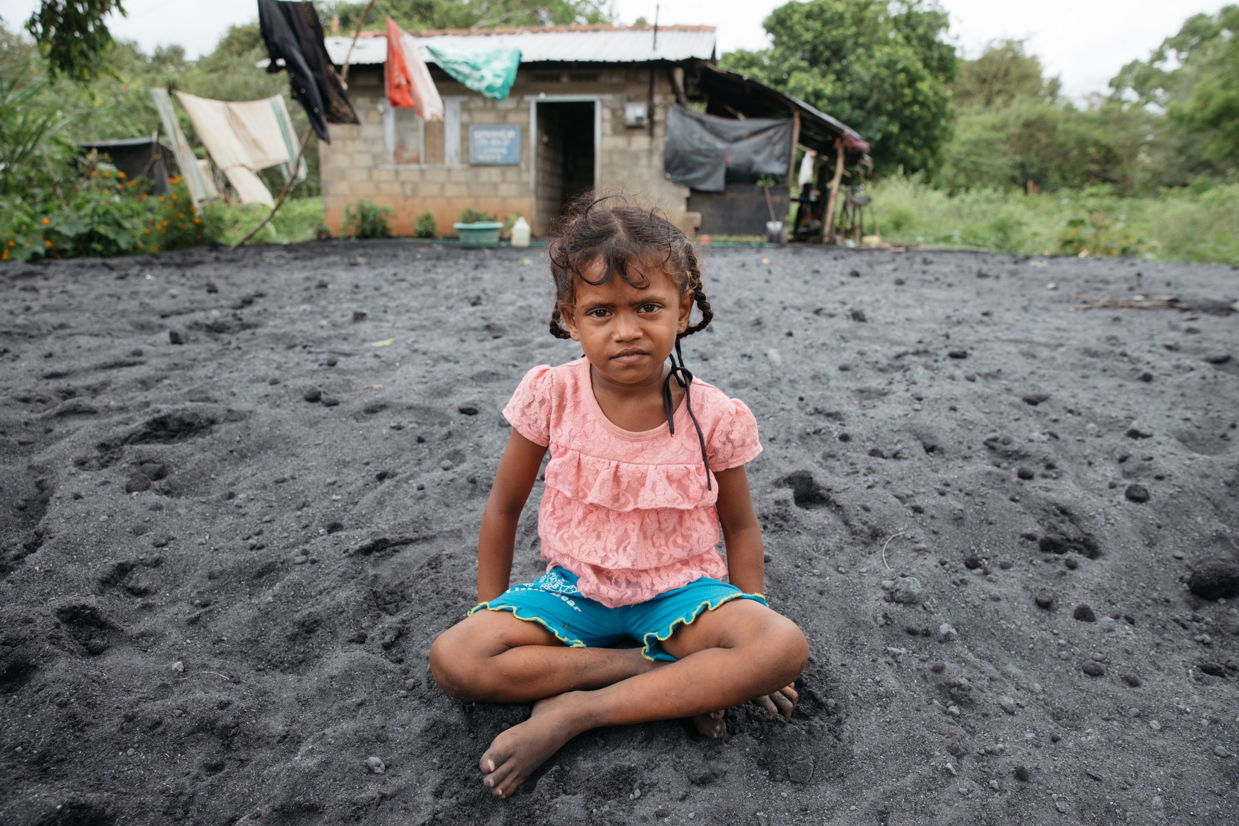 Nasmeeya, aged six, plays on her family’s plot of land