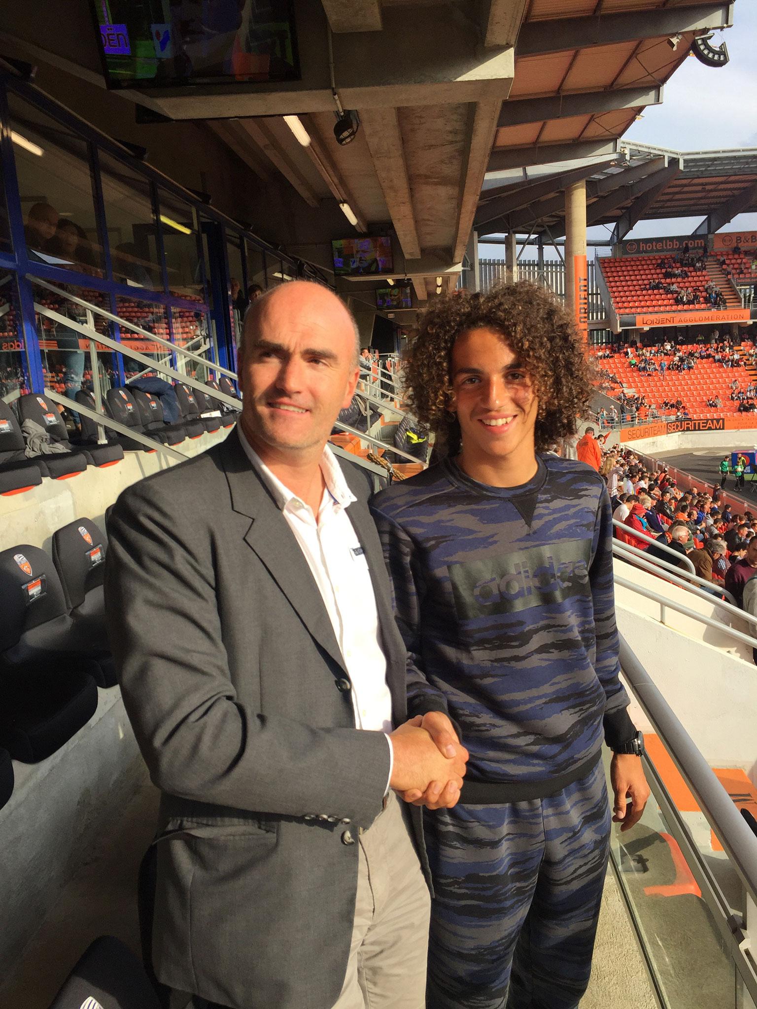 Matteo Guendouzi pictured with Loic Fery after signing his first professional contract