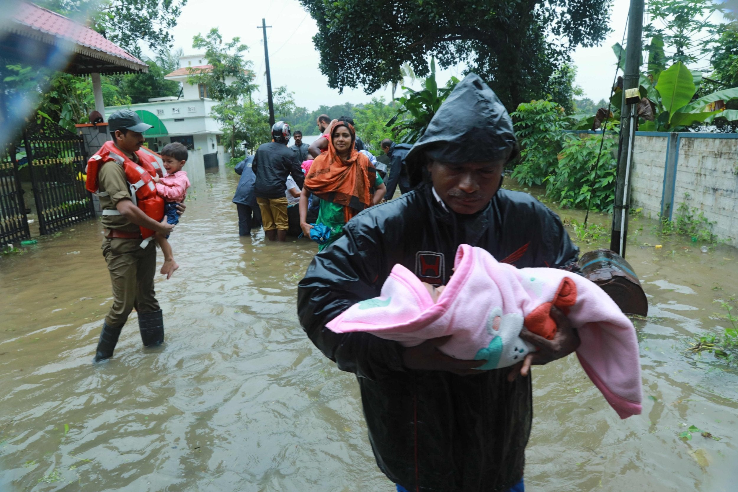 Rescue workers evacuate people in Muppathadam in Kochi's Ernakulam district