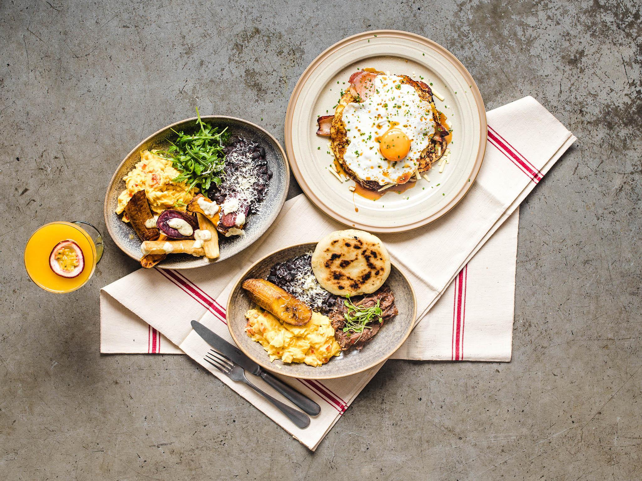 From the brunch menu is desayuno veggie (left), cachapa stack (right) and the desayuno criollo at the bottom