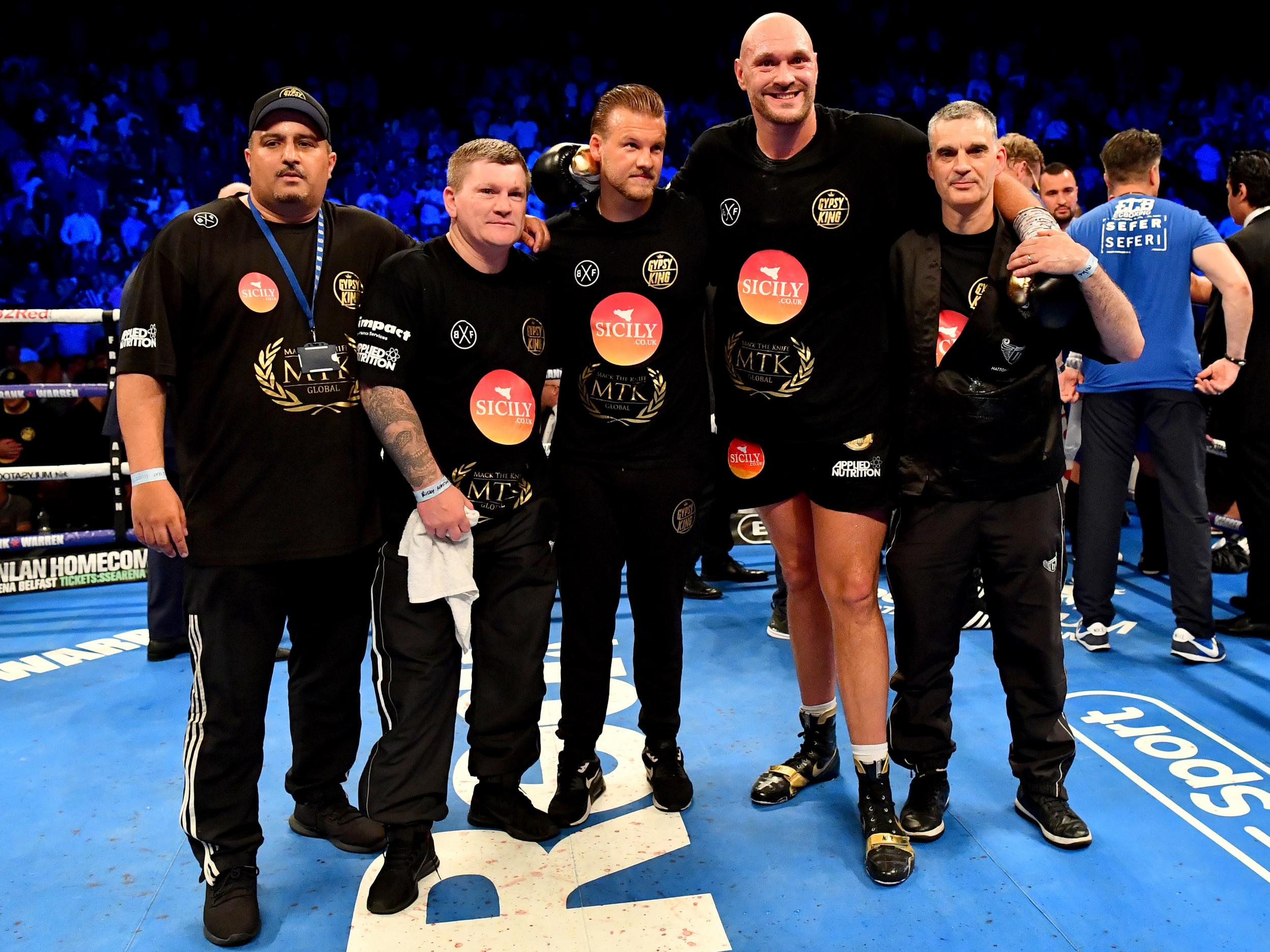 Fury and his team, which incudes Ricky Hatton and Davison (left of Fury)