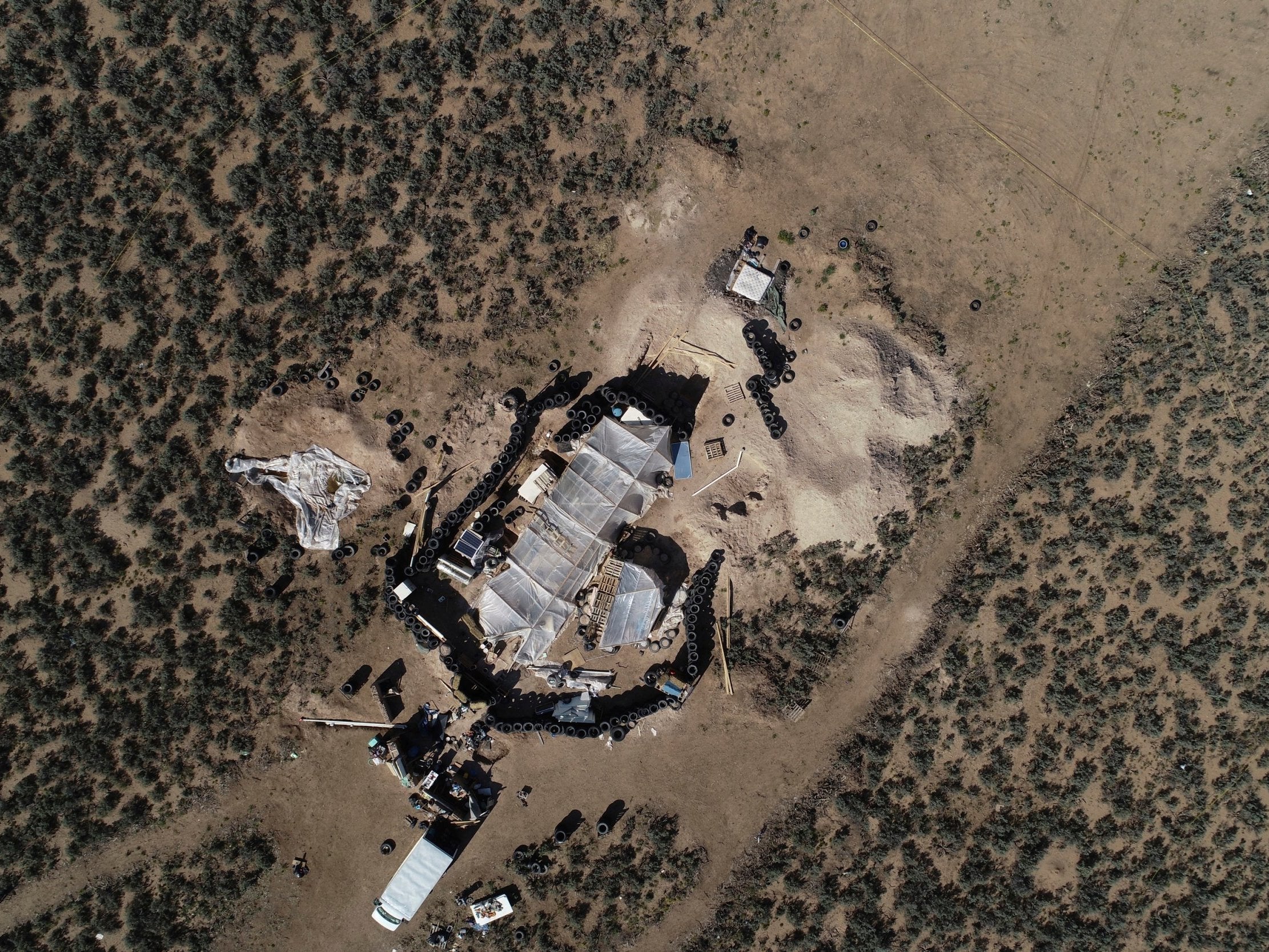 &#13;
An aerial view shows the makeshift compound in a desert area of New Mexico &#13;