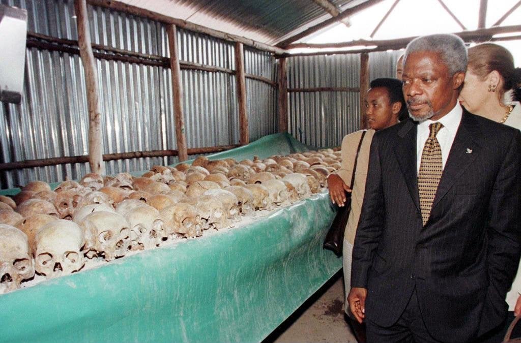 Kofi Annan walks by skulls at a memorial to the Rwandan genocide, which the UN faced criticism for failing to halt