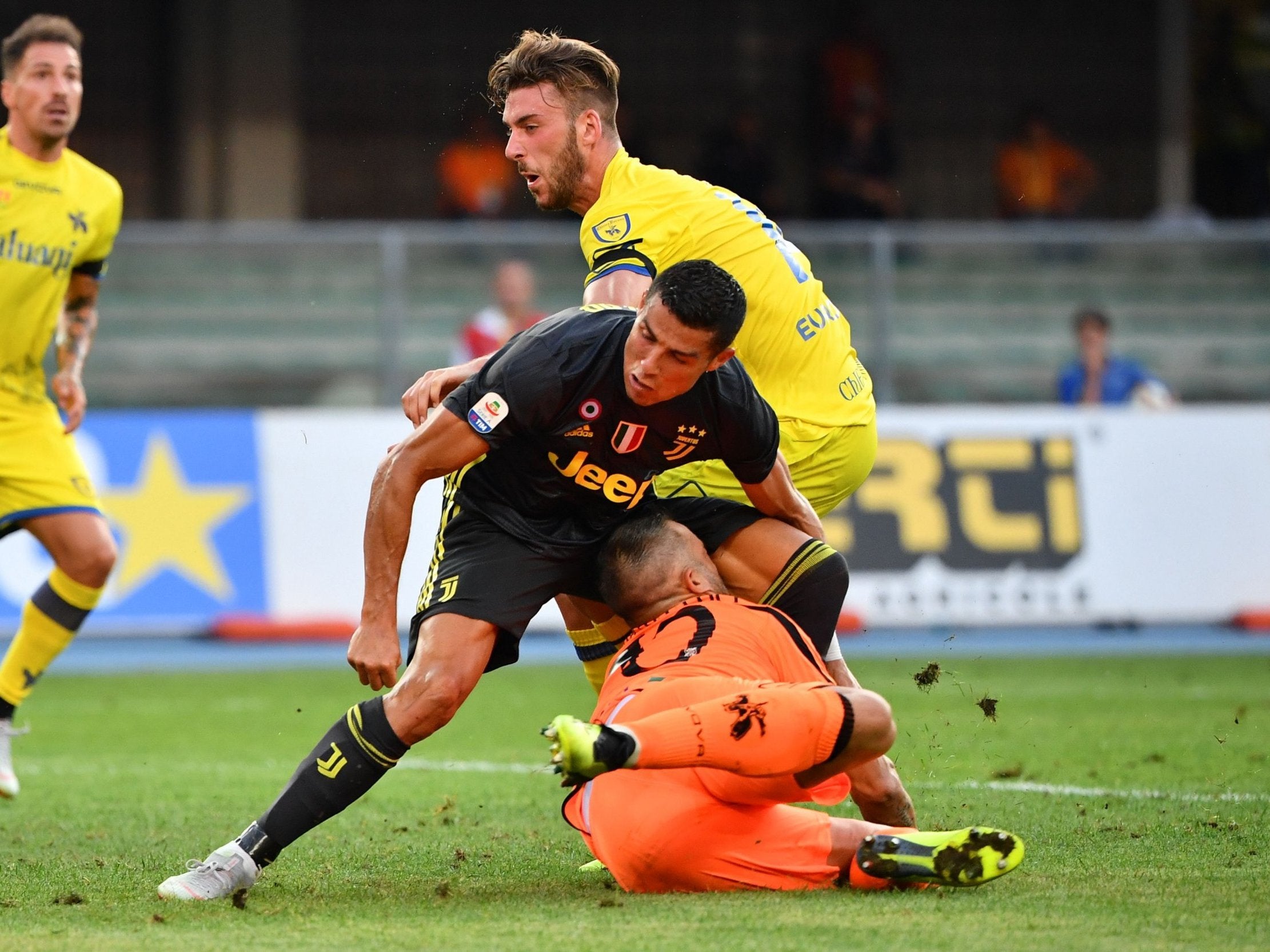 Cristiano Ronaldo collides with Chievo goalkeeper Stefano Sorrentino