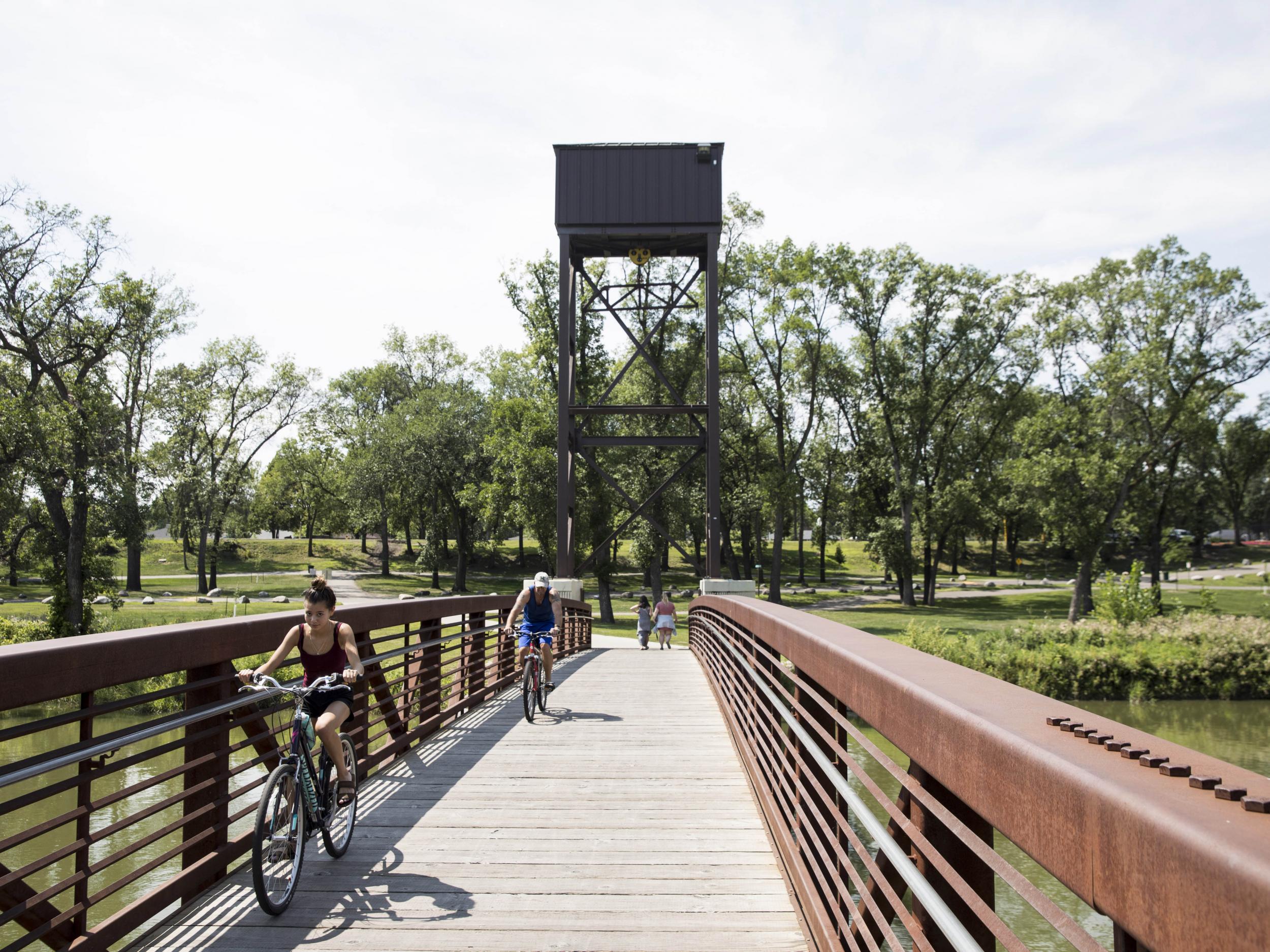 The Red River is a slow-moving waterway which marks the border between Fargo and Moorhead