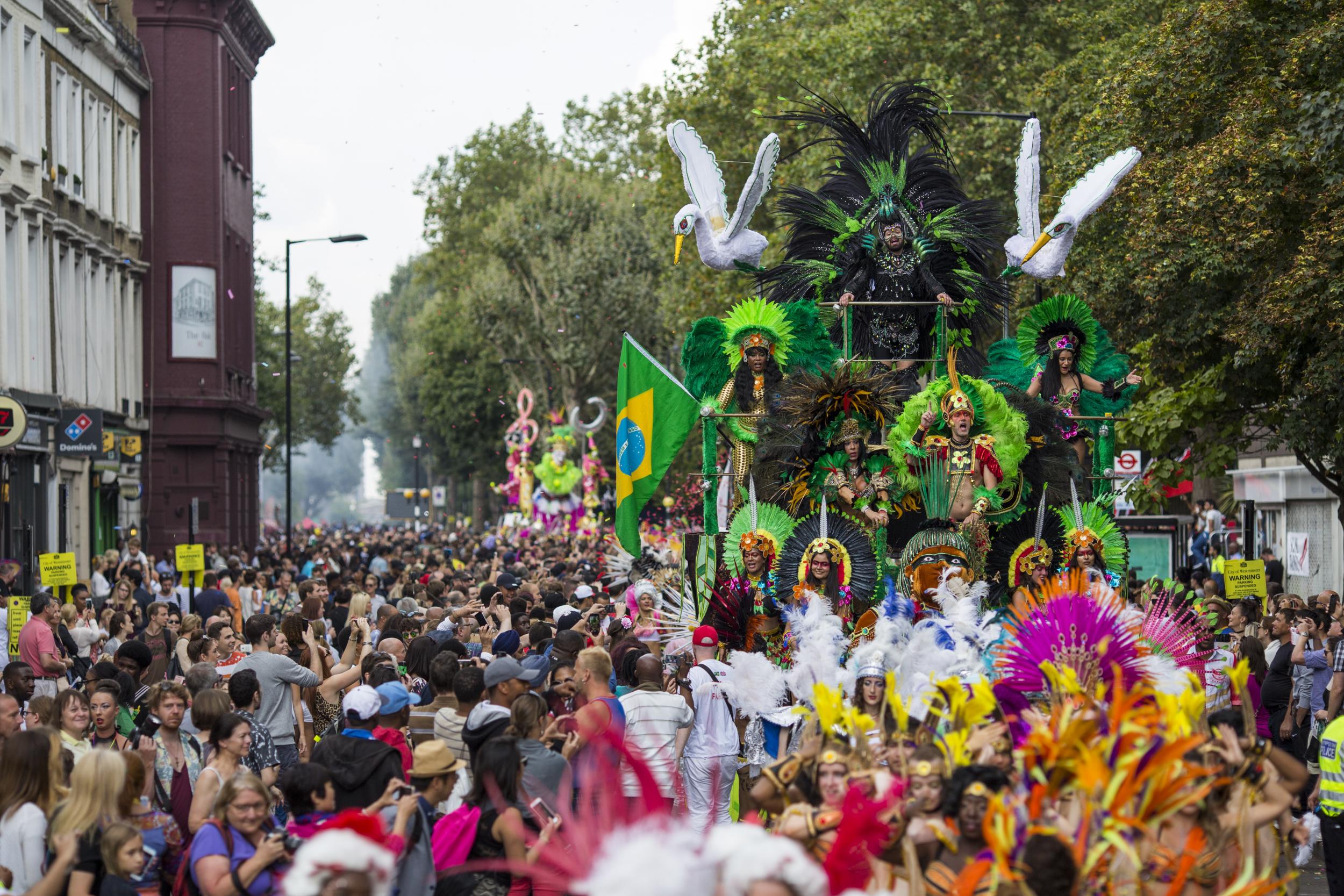 Performers on a float take part in the Notting Hill Carnival