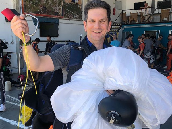 Former Brexit minister poses with reserve parachute he was forced to deploy