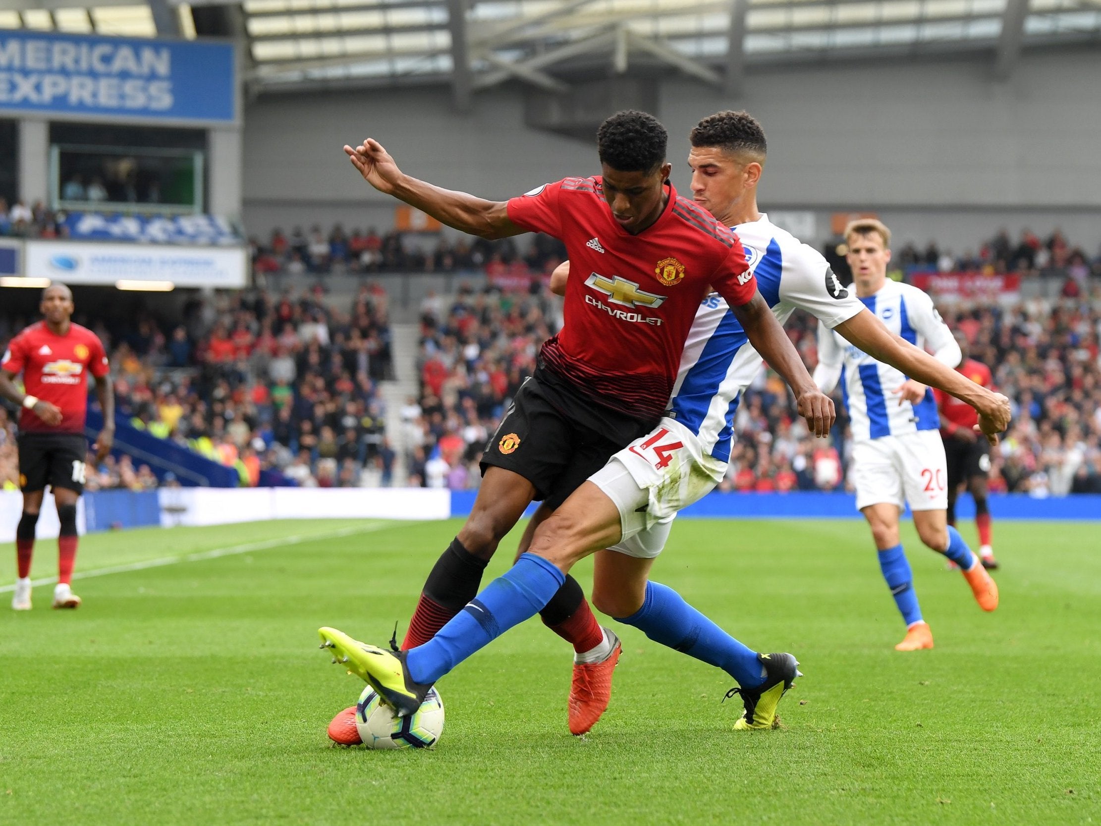 Leon Balogun wins the ball from Marcus Rashford