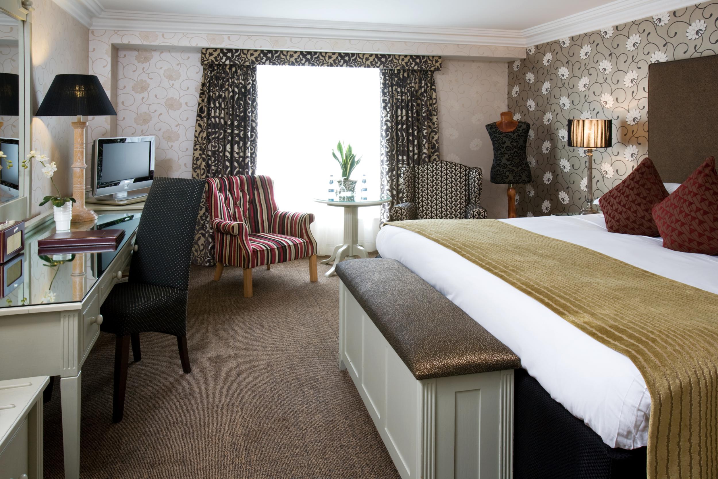 One of the Brooks Hotel's welcoming bedrooms