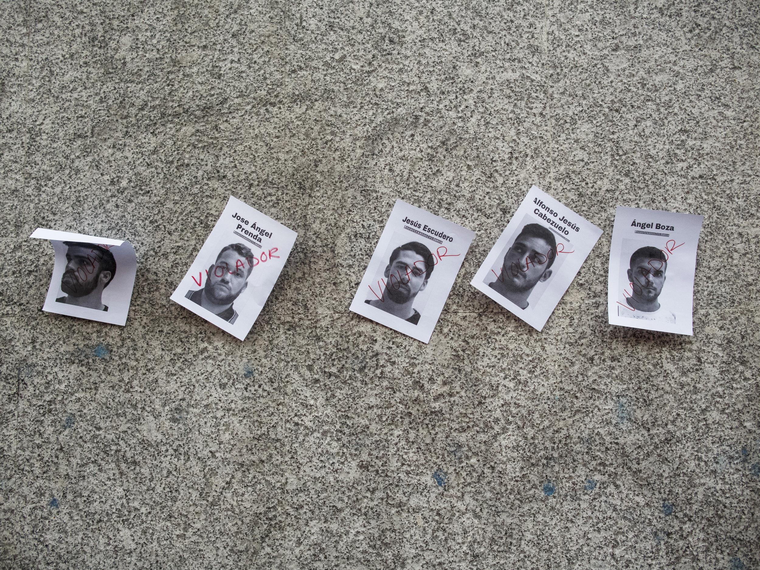 Photographs of the members of ‘La Manada‘ are stuck to the wall during a demonstration against the verdict of the ‘wolf pack’ gang case outside the Ministry of Justice on April 26, 2018 in Madrid, Spain.