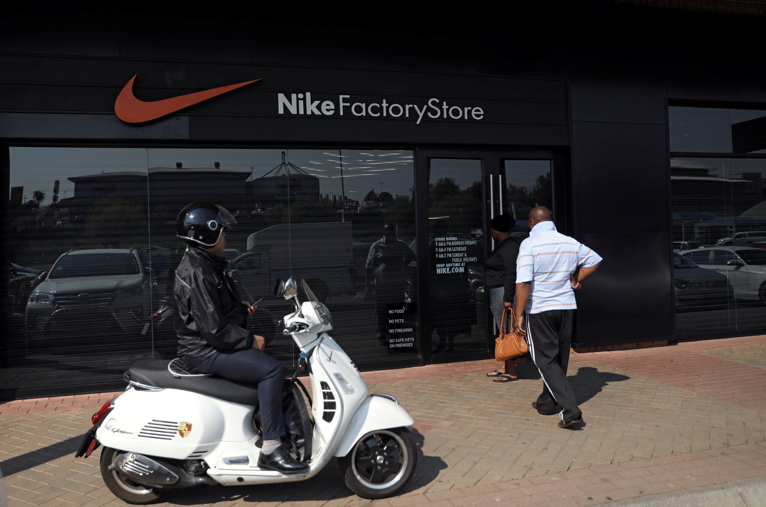 A man reacts as he finds a Nike store closed in Johannesburg, South Africa, August 22, 2018. REUTERS/Siphiwe Sibeko