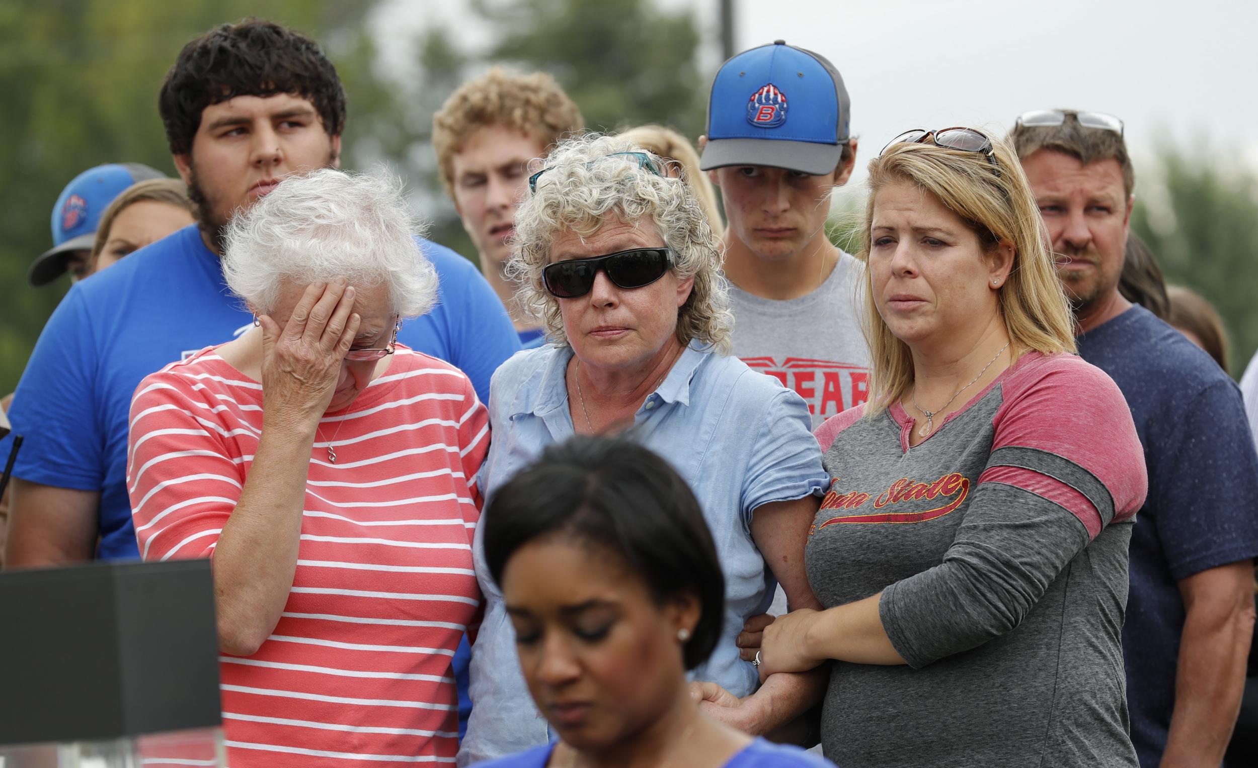 Friends and family of missing University of Iowa student Mollie Tibbetts react during a news conference, Tuesday, Aug. 21, 2018, in Montezuma, Iowa.