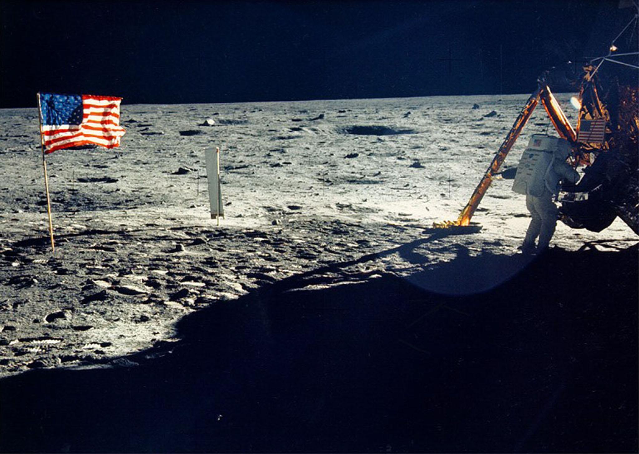 One of the few photographs of Neil Armstrong on the moon shows him working on his space craft on the lunar surface