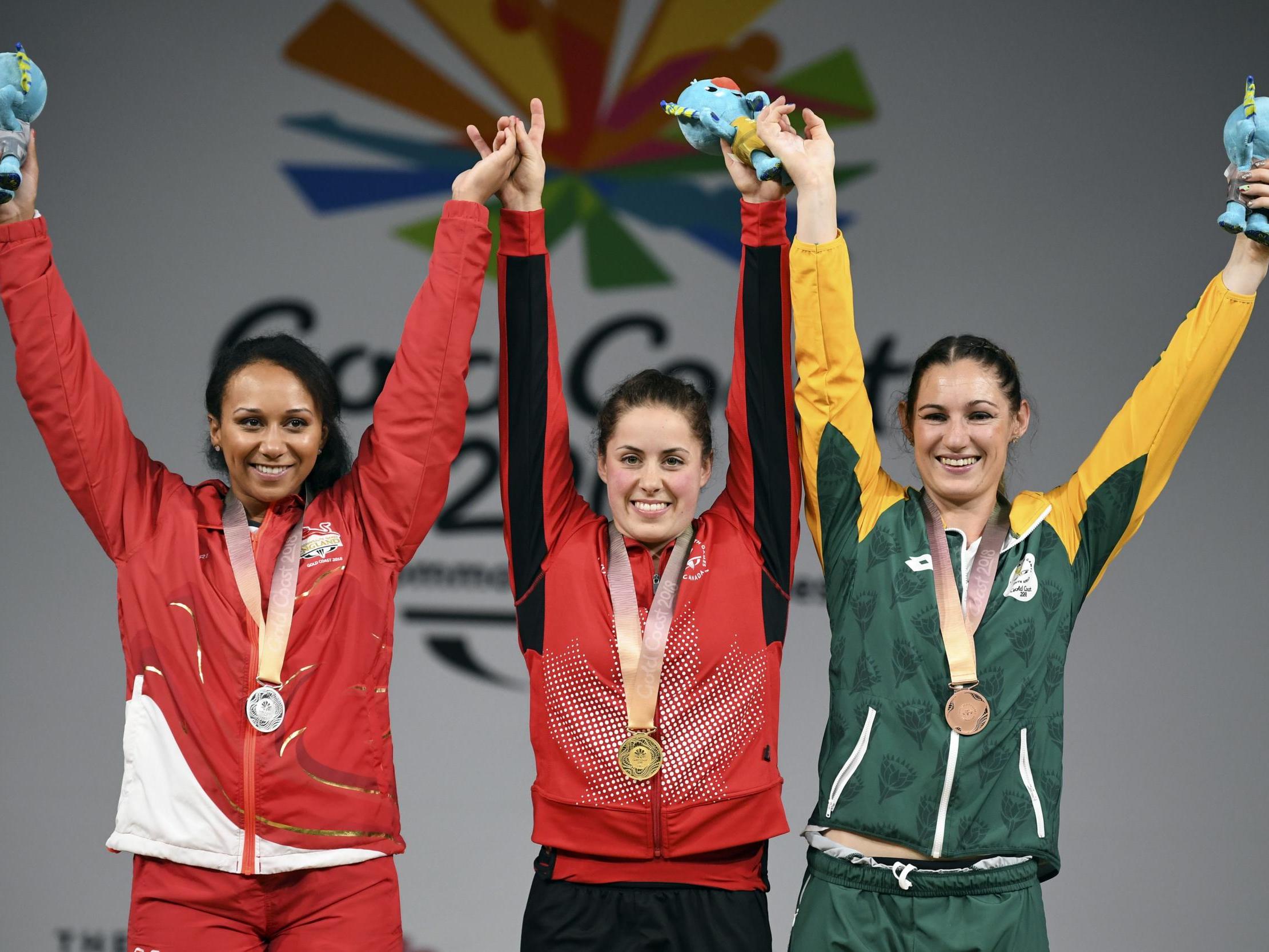 Zoe Smith, left, celebrates her silver medal on the Gold Coast