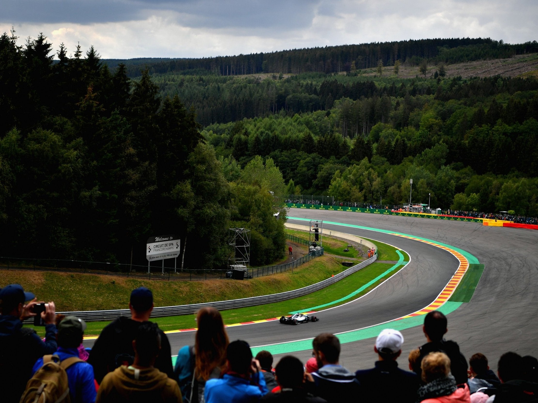 Spectators watch Lewis Hamilton during qualifying