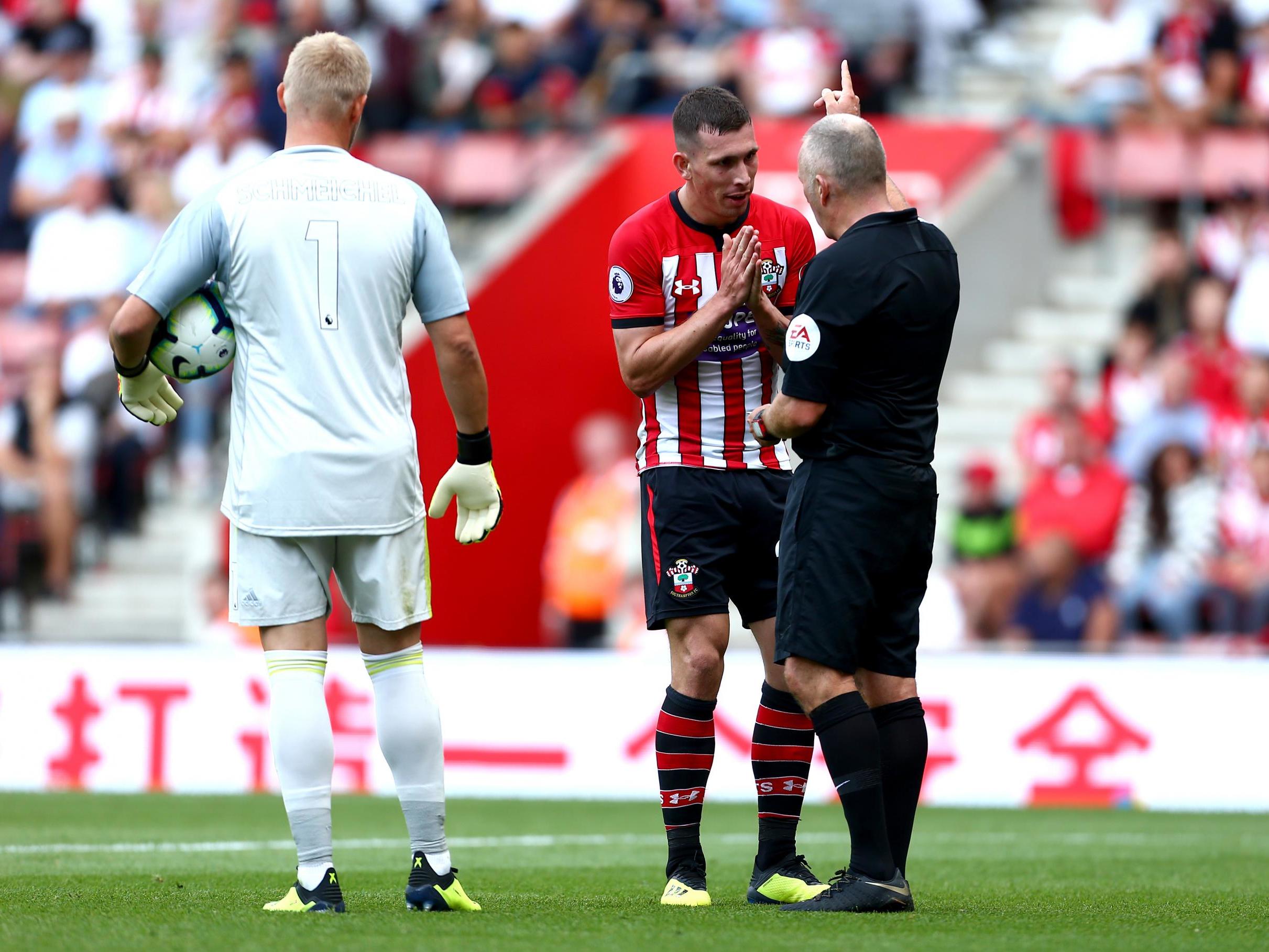 Pierre-Emile Hojbjerg is dismissed for a second yellow card after diving in the Leicester box