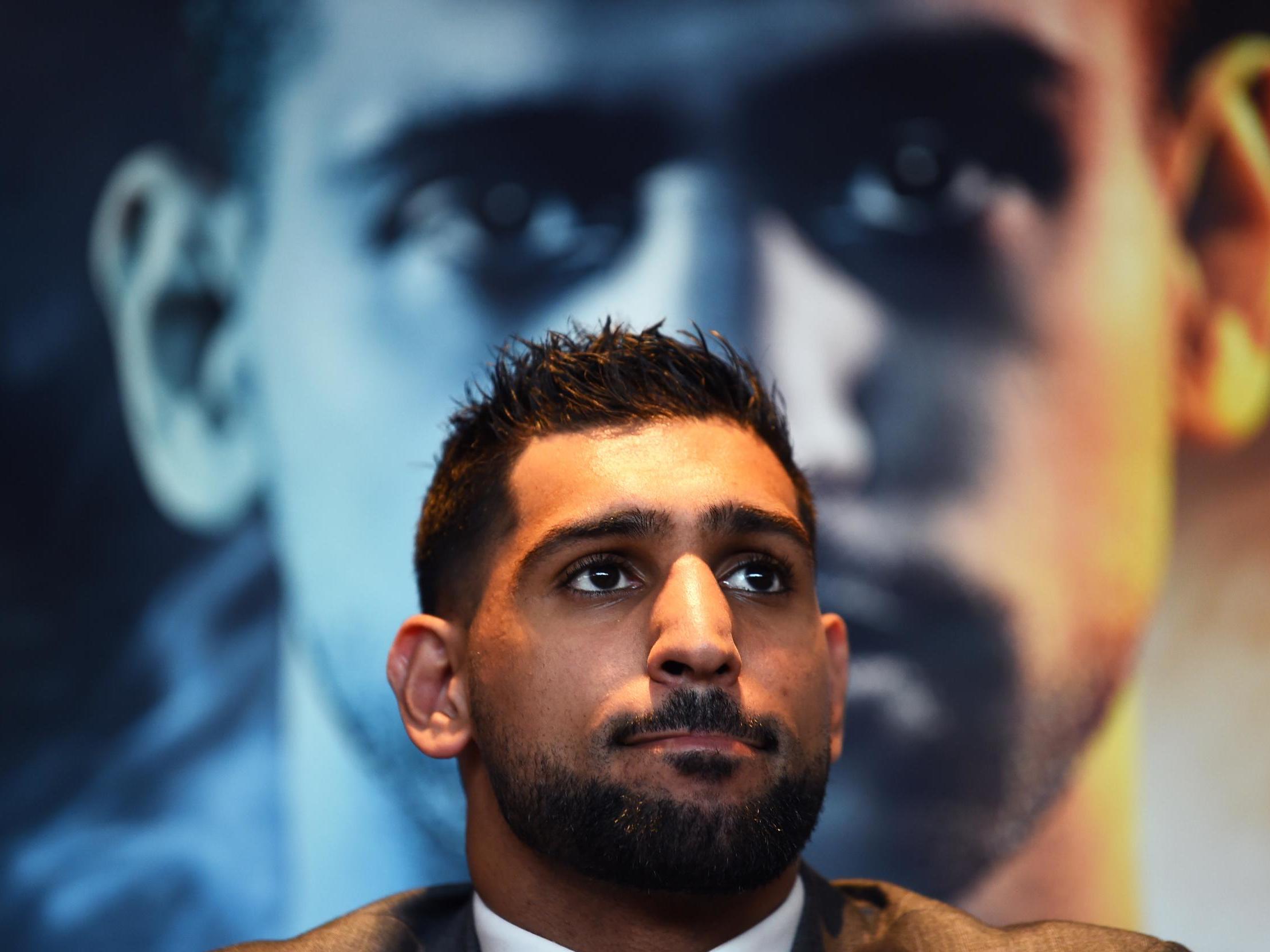 Amir Khan talks to the media during a press conference