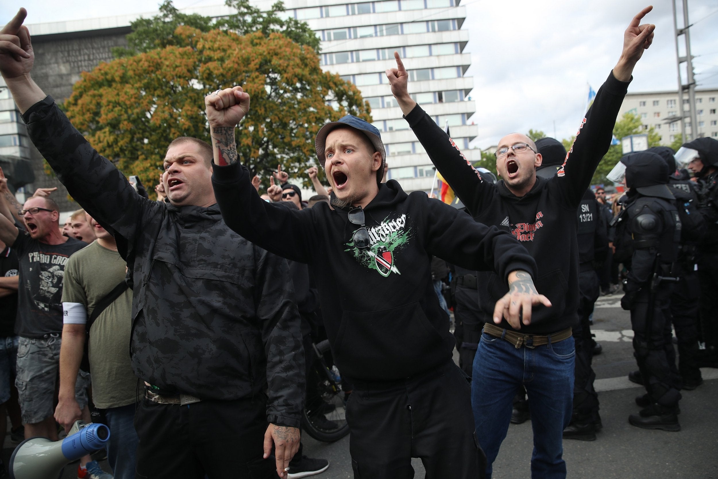 Far-right supporters chant at anti-fascist rivals in Chemnitz (Getty)