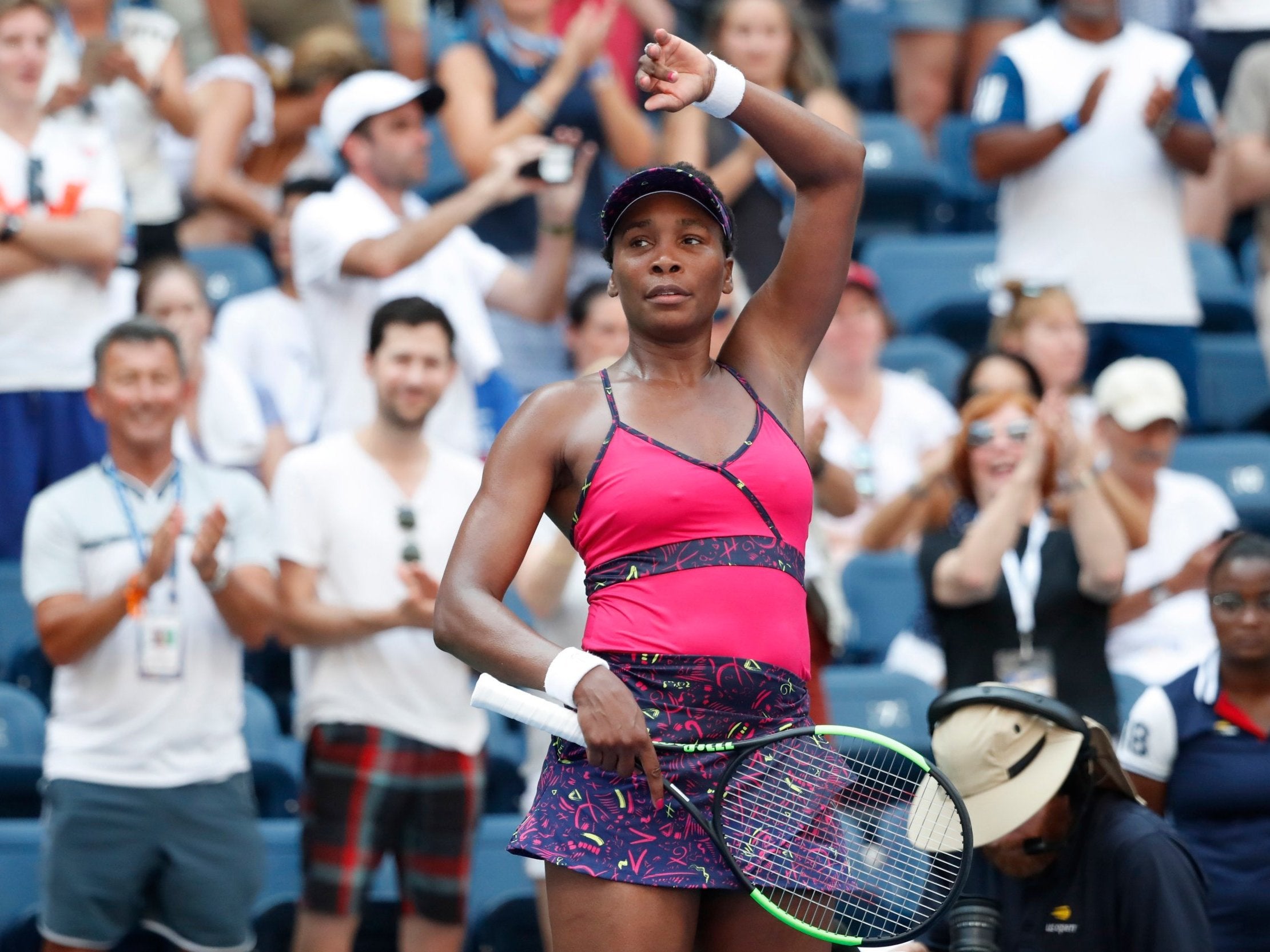 Venus Williams salutes the crowd after beating Camila Giorgi