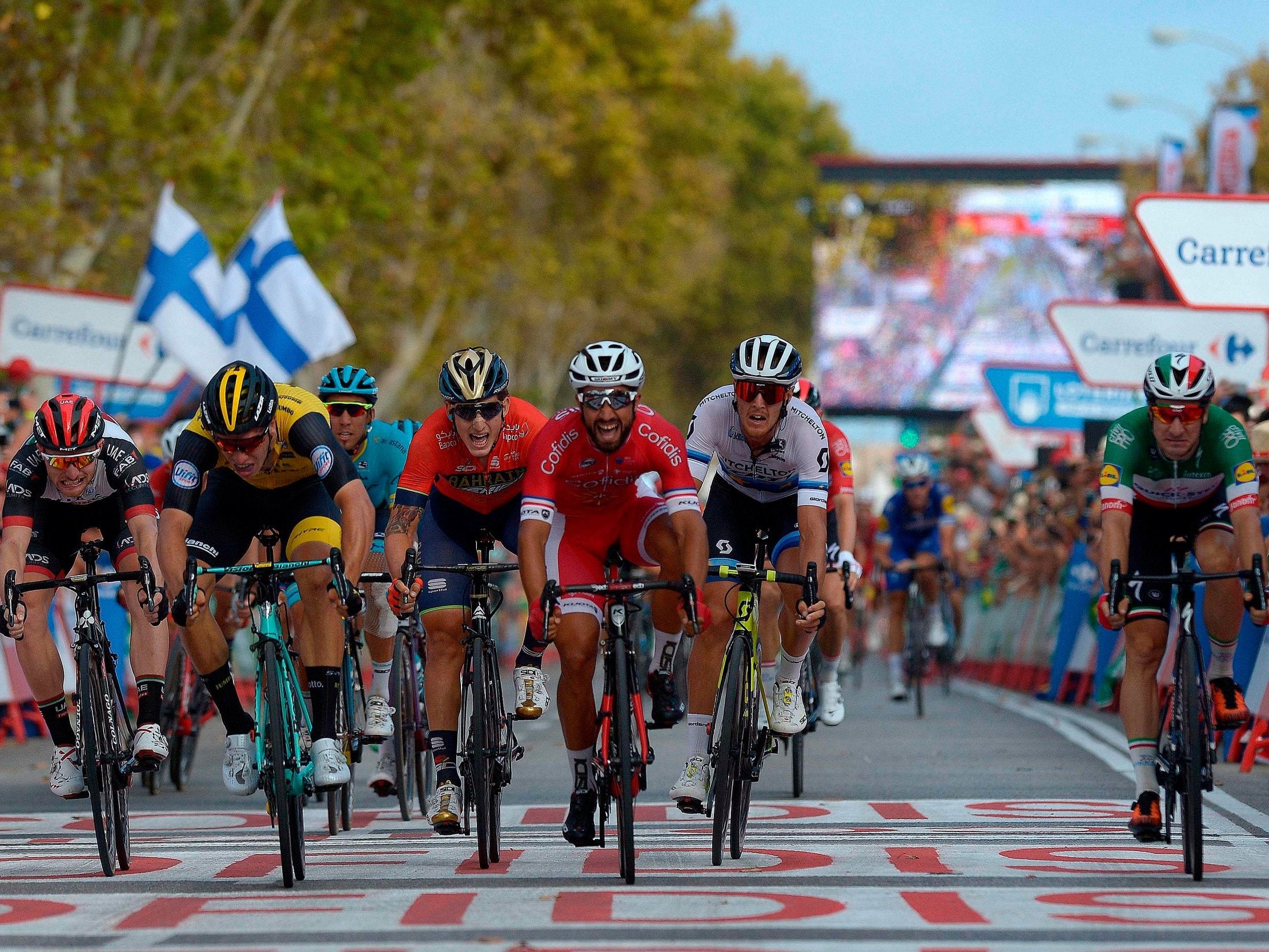 Nacer Bouhani, in red, wins a sprint on the line