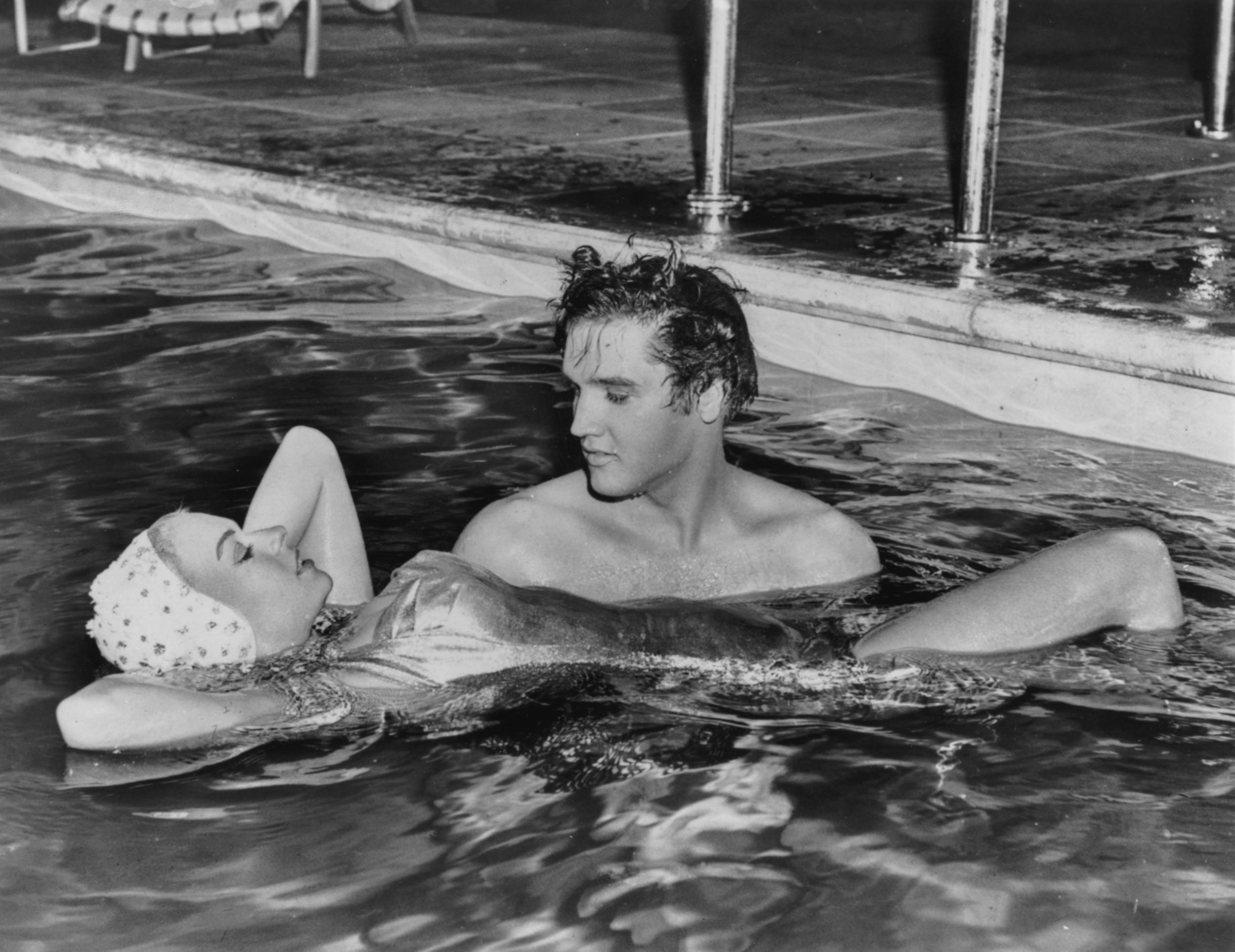 Presley holding up Jennifer Holden, his ‘Jailhouse Rock’ costar in 1957 (Keystone/Hulton Archive/Getty)