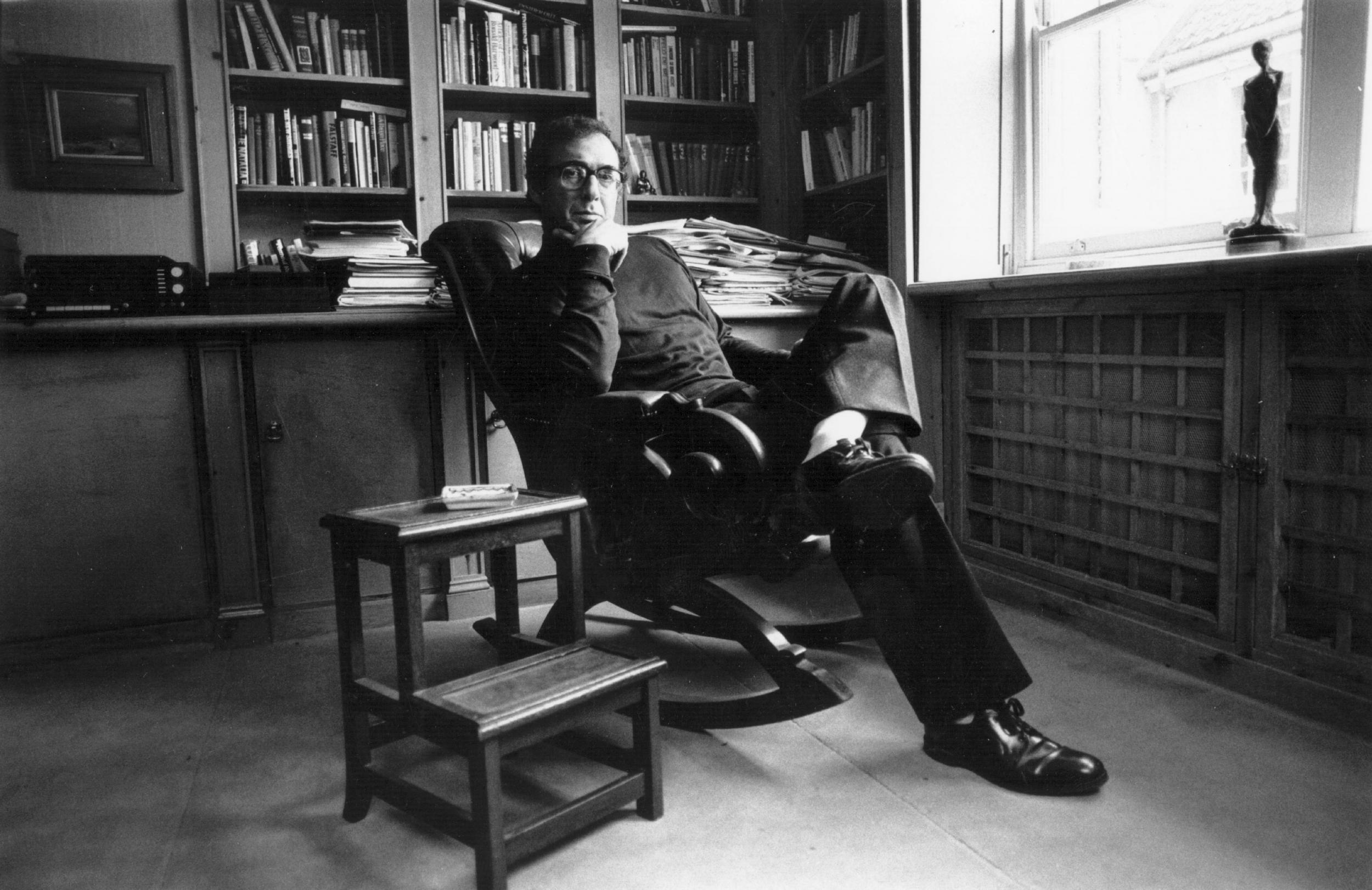 Harold Pinter relaxing in his study