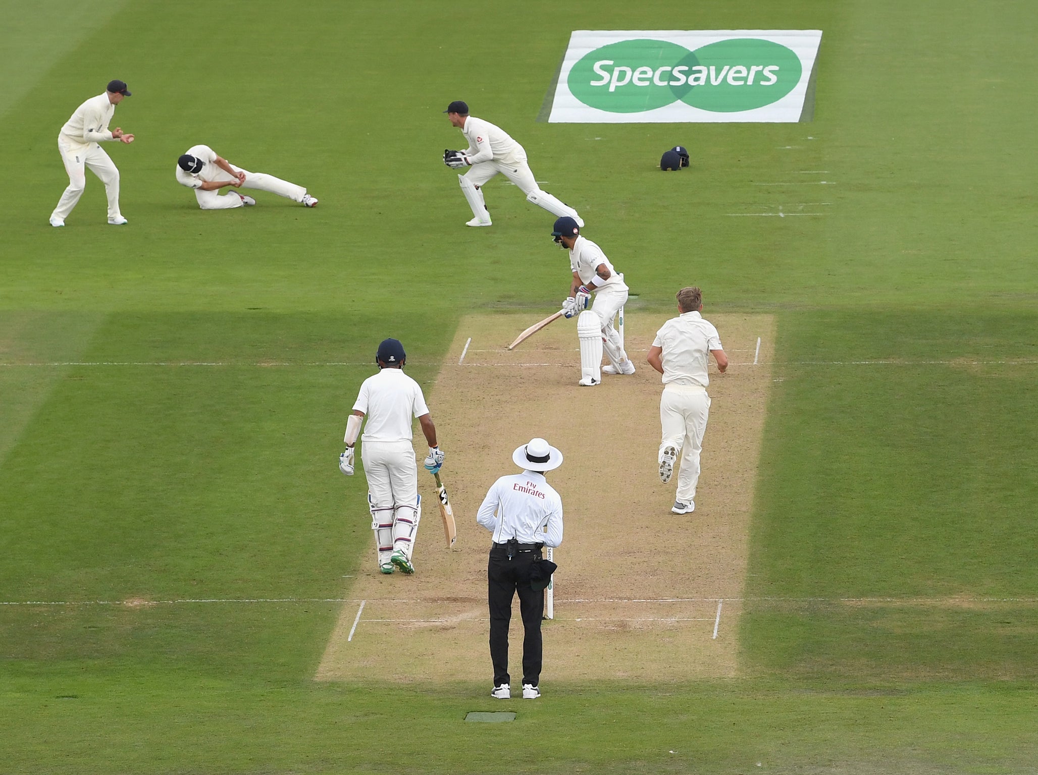 Virat Kohli is caught by Alastair Cook at second slip for 46