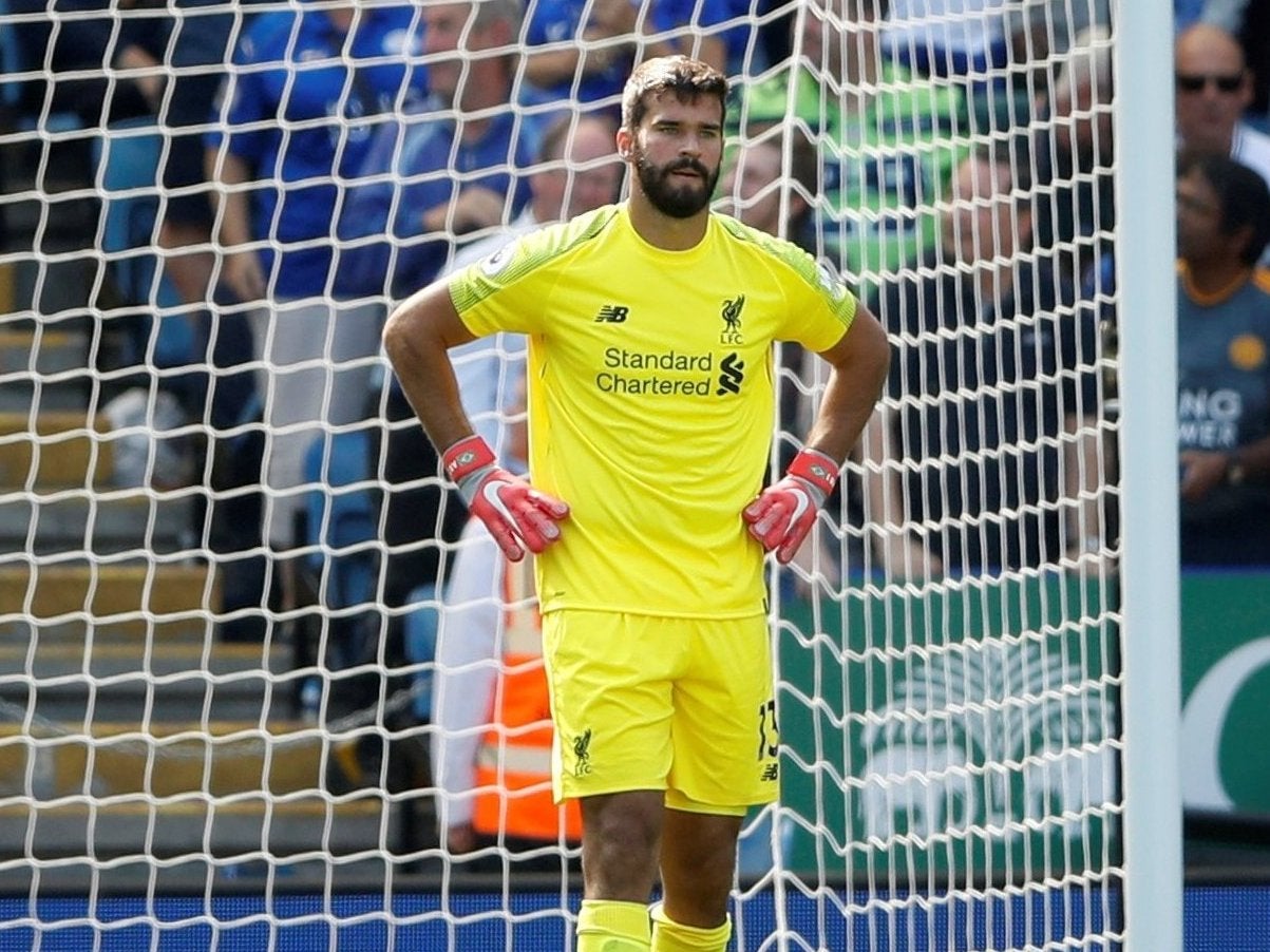 Alisson looks dejected after his error at Leicester City