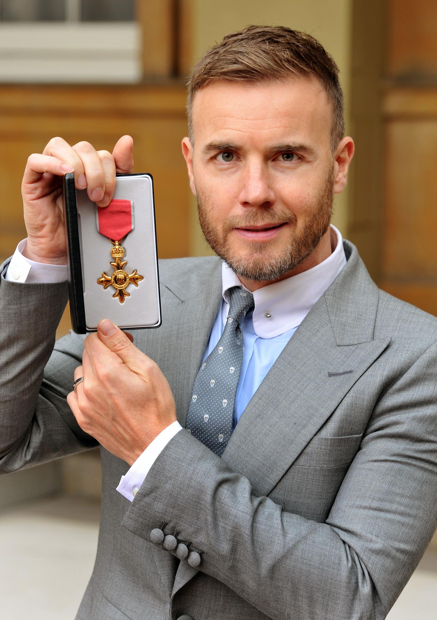 Gary Barlow, who was awarded an OBE for services to the entertainment industry and to charity