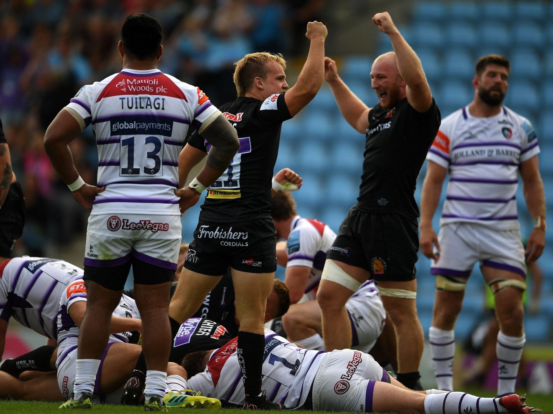 Exeter celebrate a try during their rout of Leicester