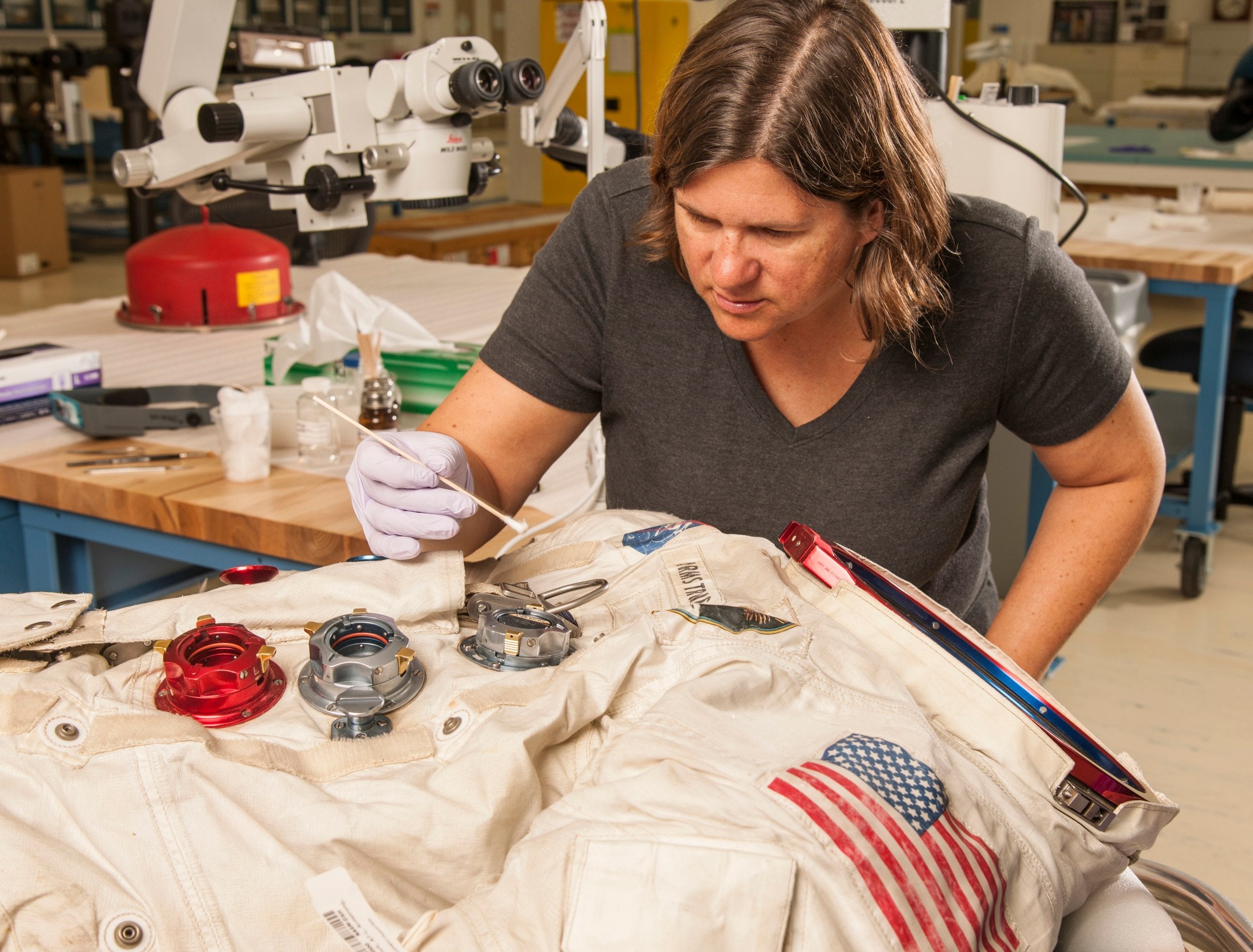 Needs a touch up: a conservator works on Armstrong’s spacesuit