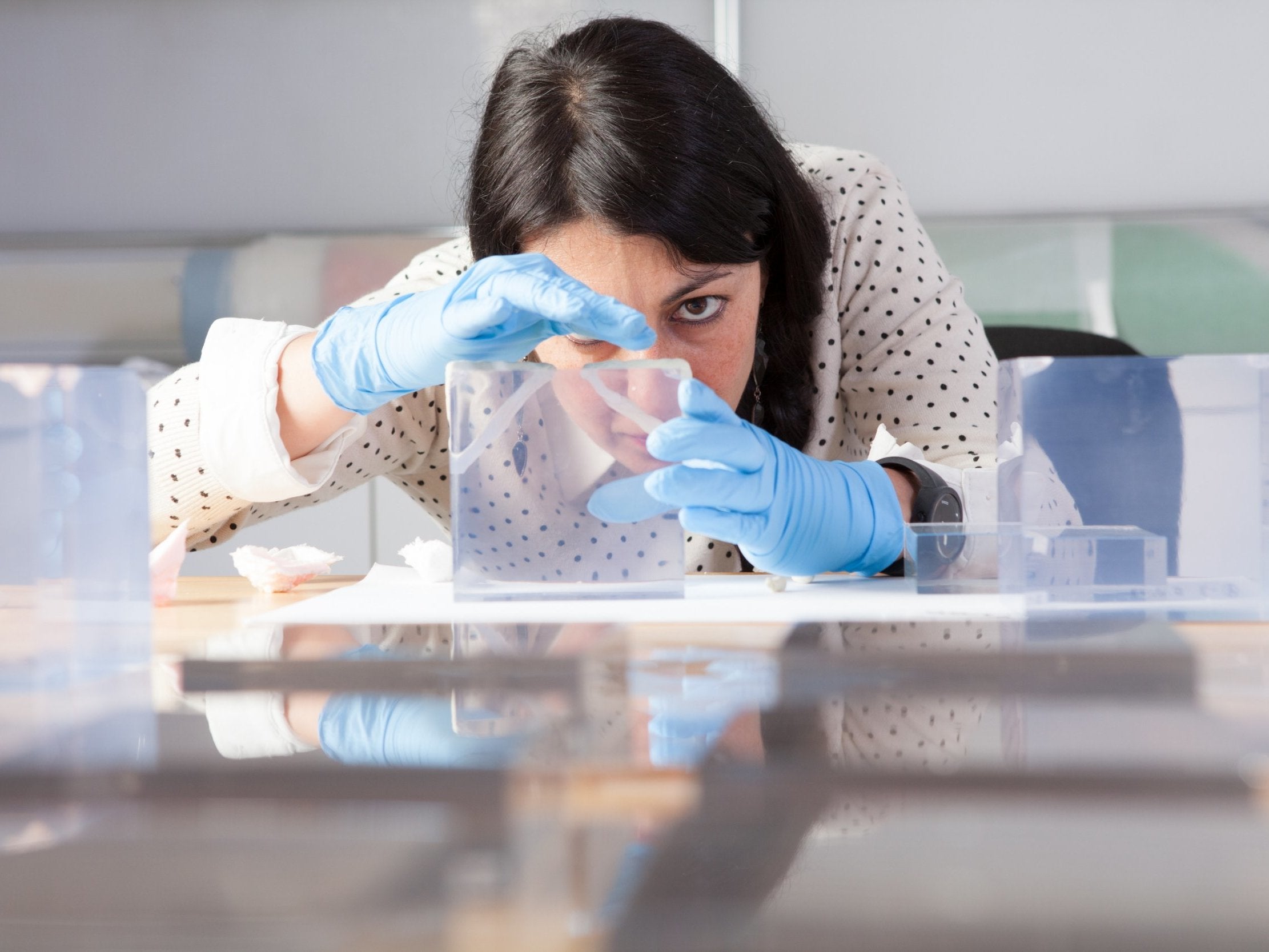 Source material: Anna Lagana tries to identify what kind of plastic she is dealing with (J Paul Getty Trust)