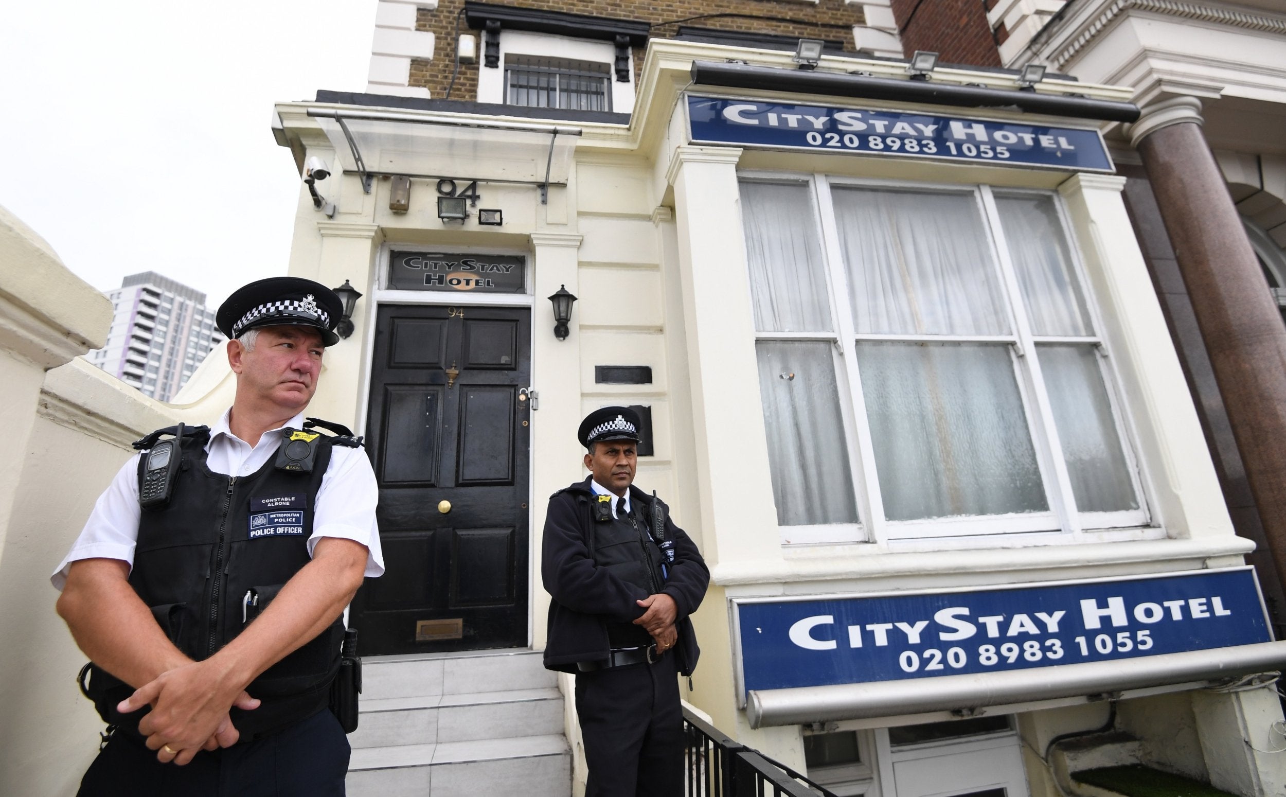 Police outside the City Stay hotel in Bow, east London, where the two men stayed and where traces of the nerve agent where found